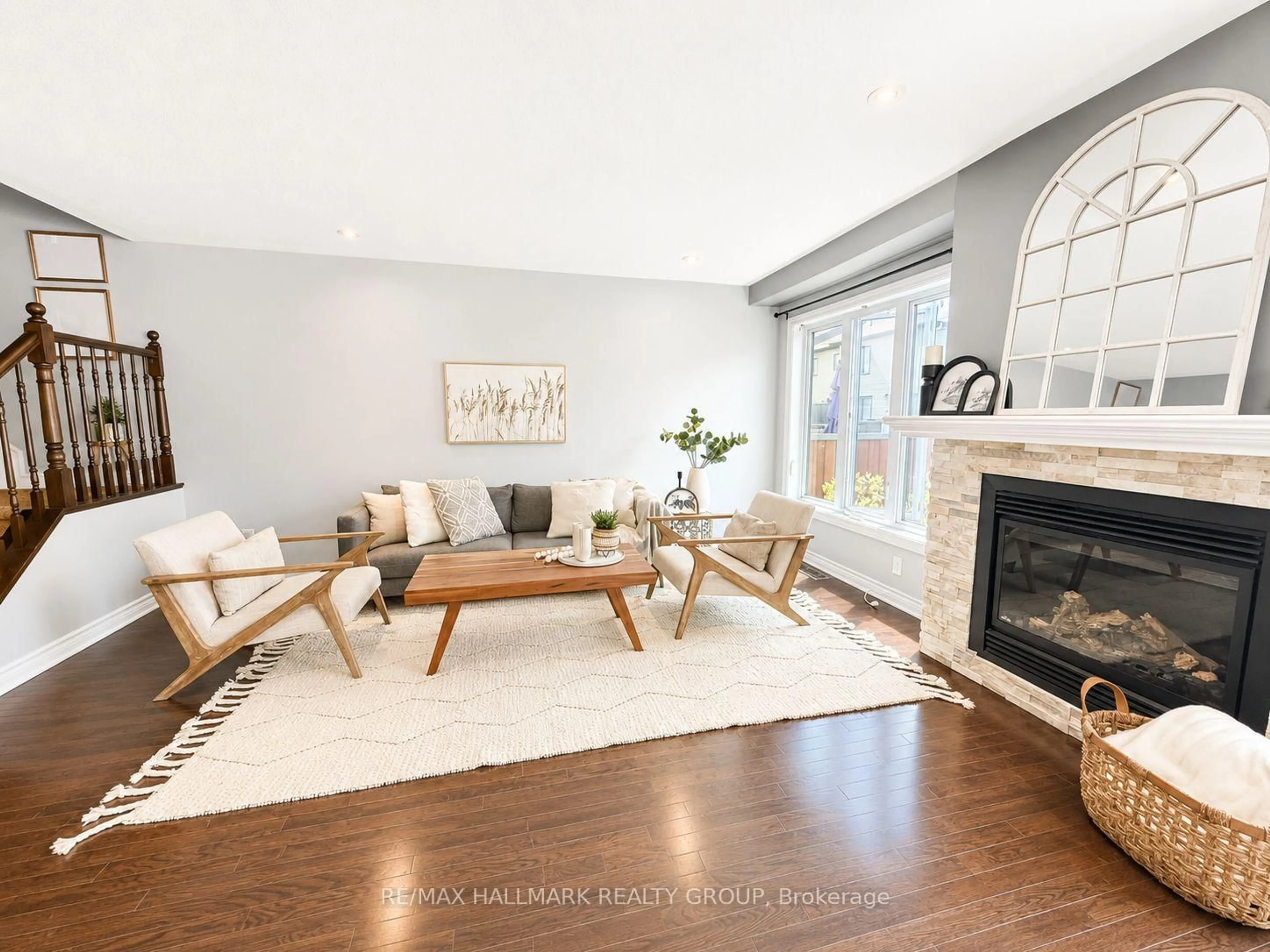 Living room with furniture, wood/laminate floor for 659 Petrichor Cres, Ottawa Ontario K4A 0Y4