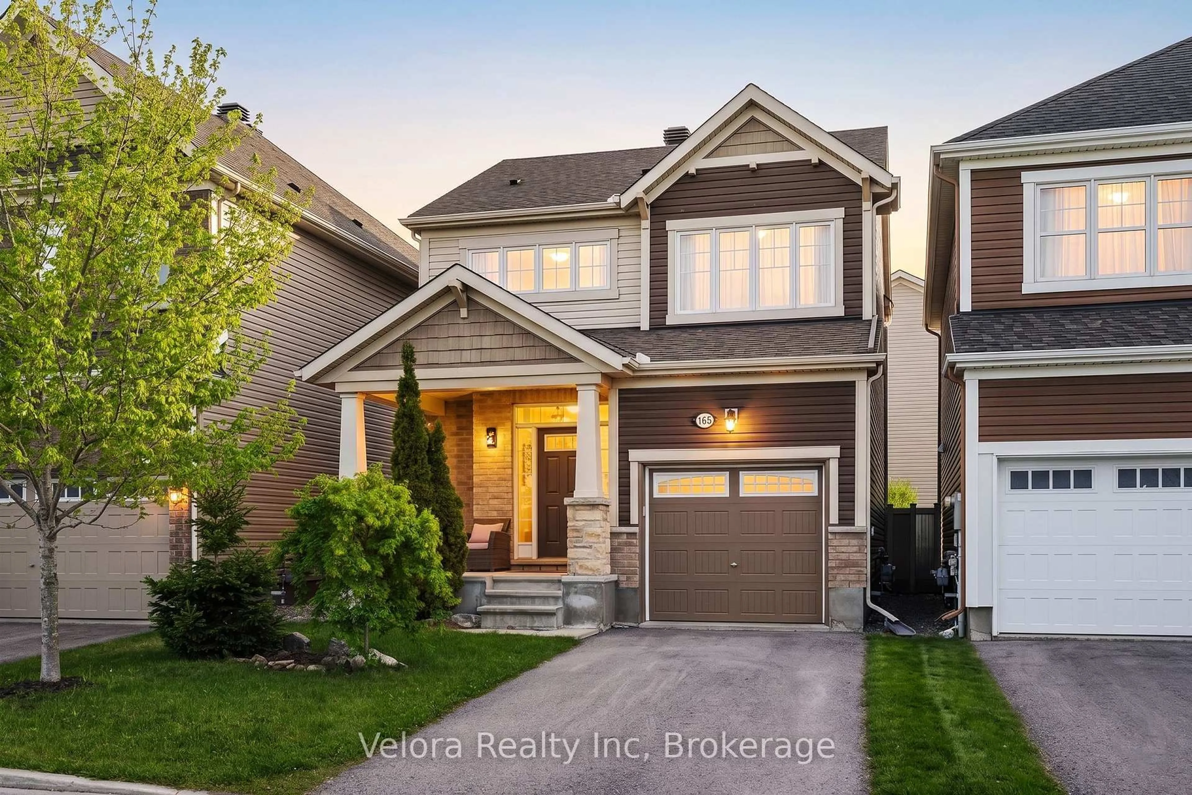 Home with vinyl exterior material, street for 165 Santolina St, Ottawa Ontario K2S 0W9