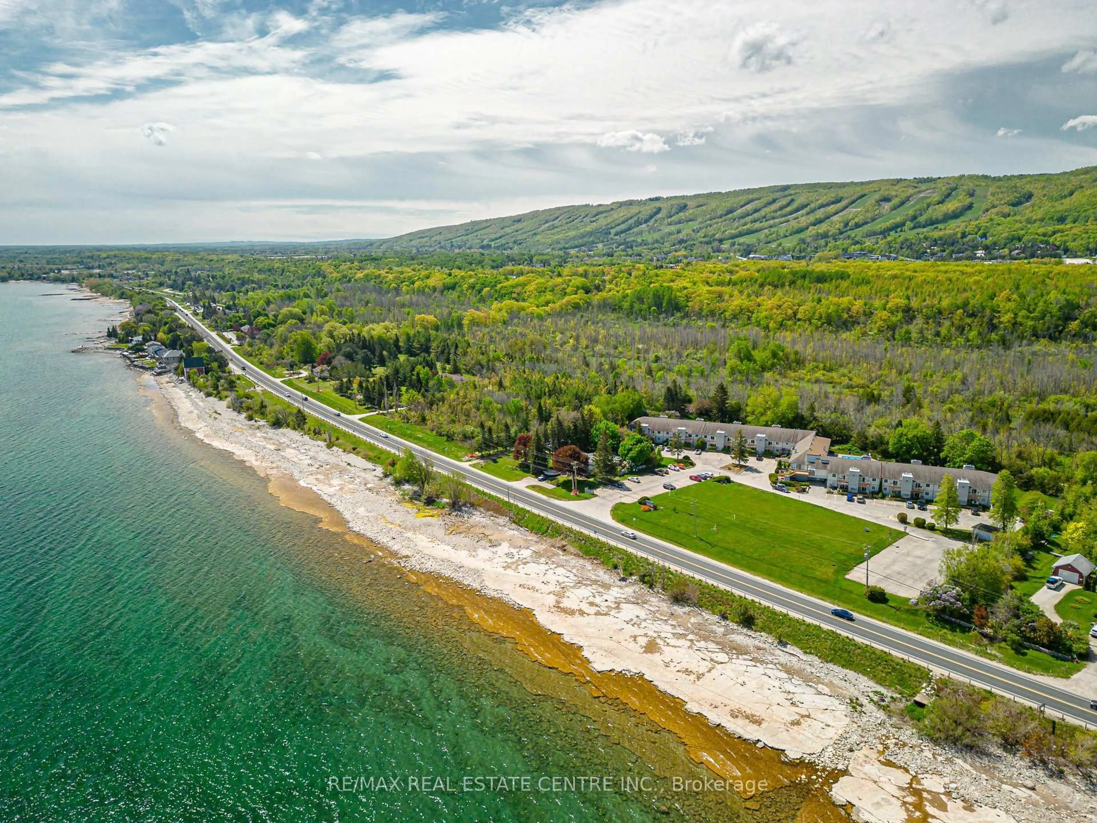 A pic from outside/outdoor area/front of a property/back of a property/a pic from drone, water/lake/river/ocean view for 209472 Highway 26 #19, Blue Mountains Ontario L9Y 0V3