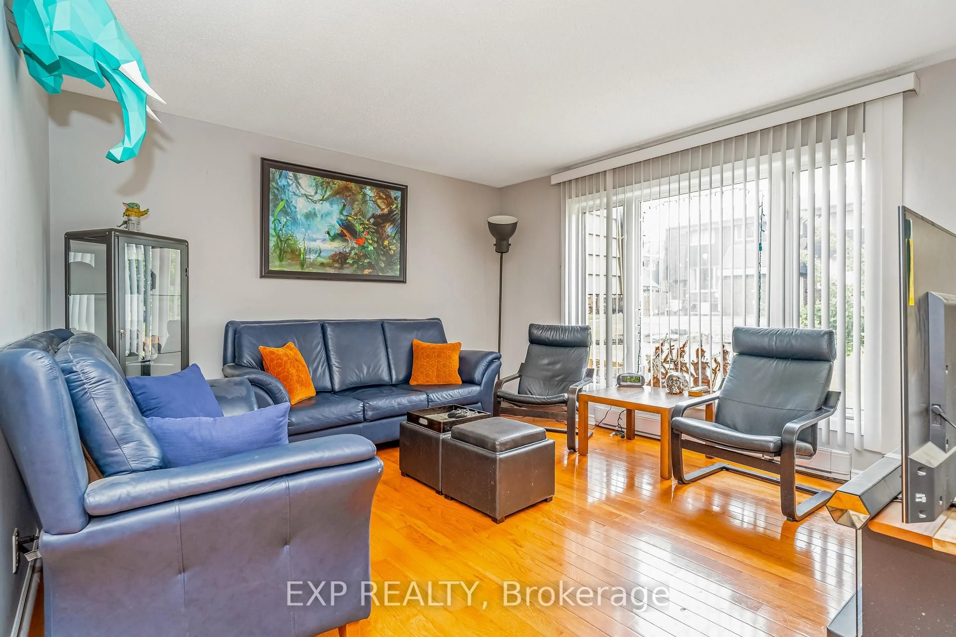 Living room with furniture, wood/laminate floor for 2610 Draper Ave #12, Ottawa Ontario K2H 8X8