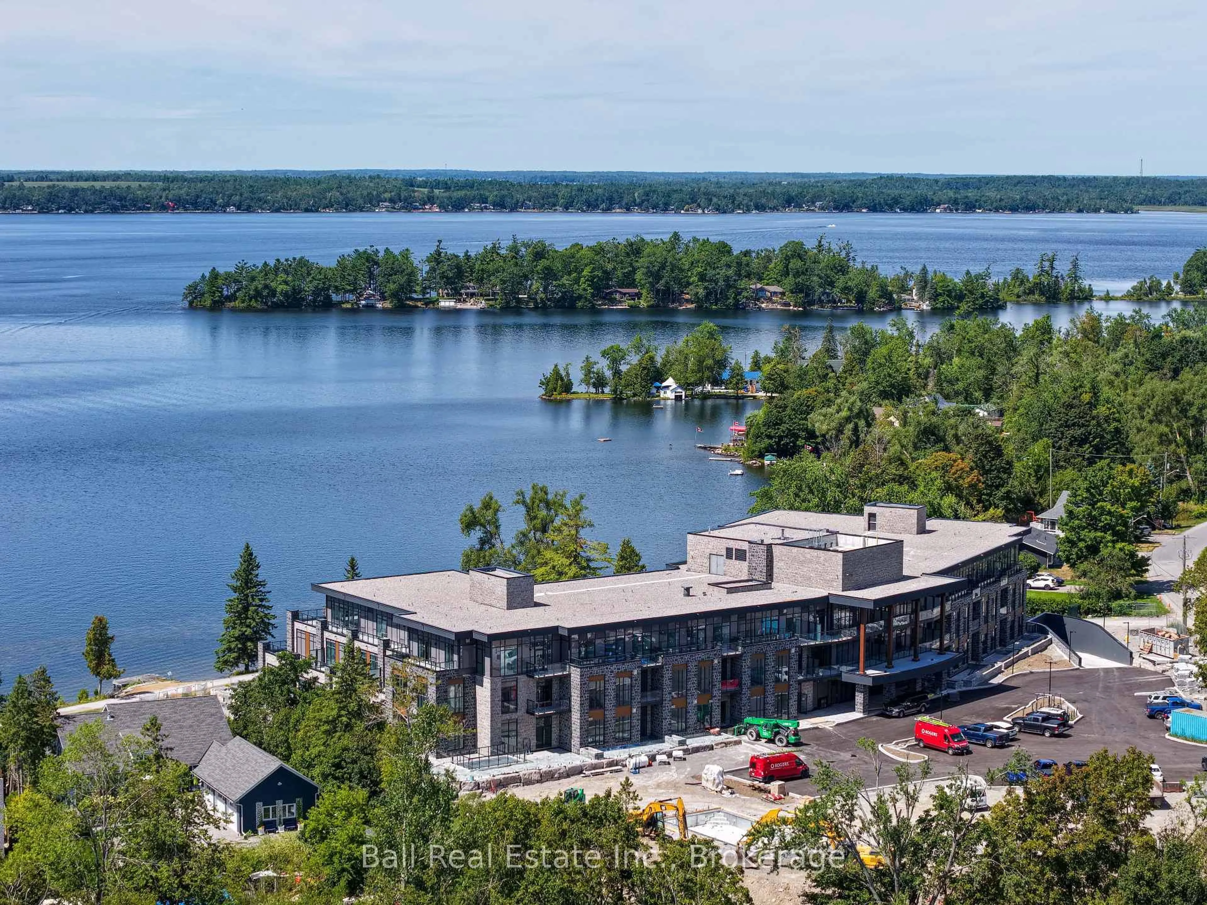 A pic from outside/outdoor area/front of a property/back of a property/a pic from drone, water/lake/river/ocean view for 99 Louisa St #107, Kawartha Lakes Ontario K0M 1N0