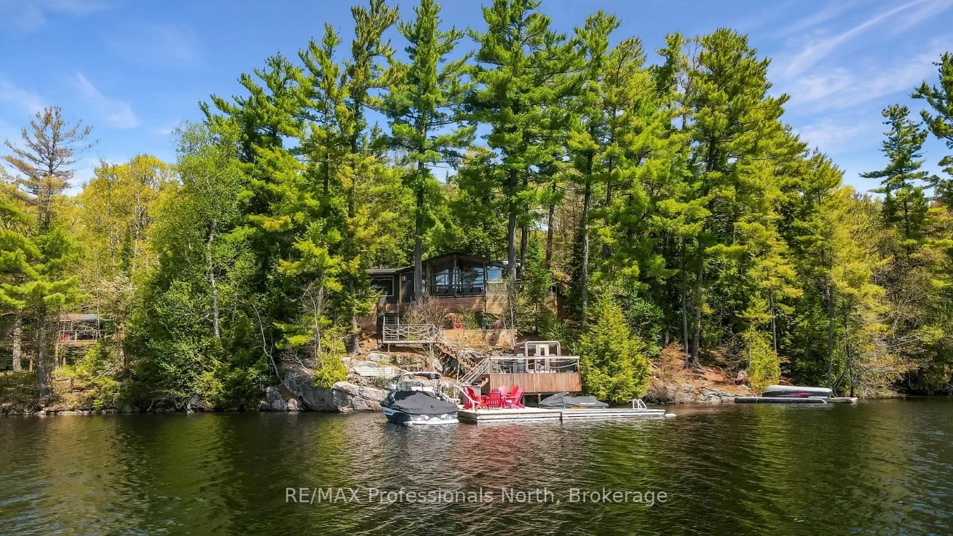 A pic from outside/outdoor area/front of a property/back of a property/a pic from drone, water/lake/river/ocean view for 1025 Huckleberry Lane, Dysart et al Ontario K0M 1S0
