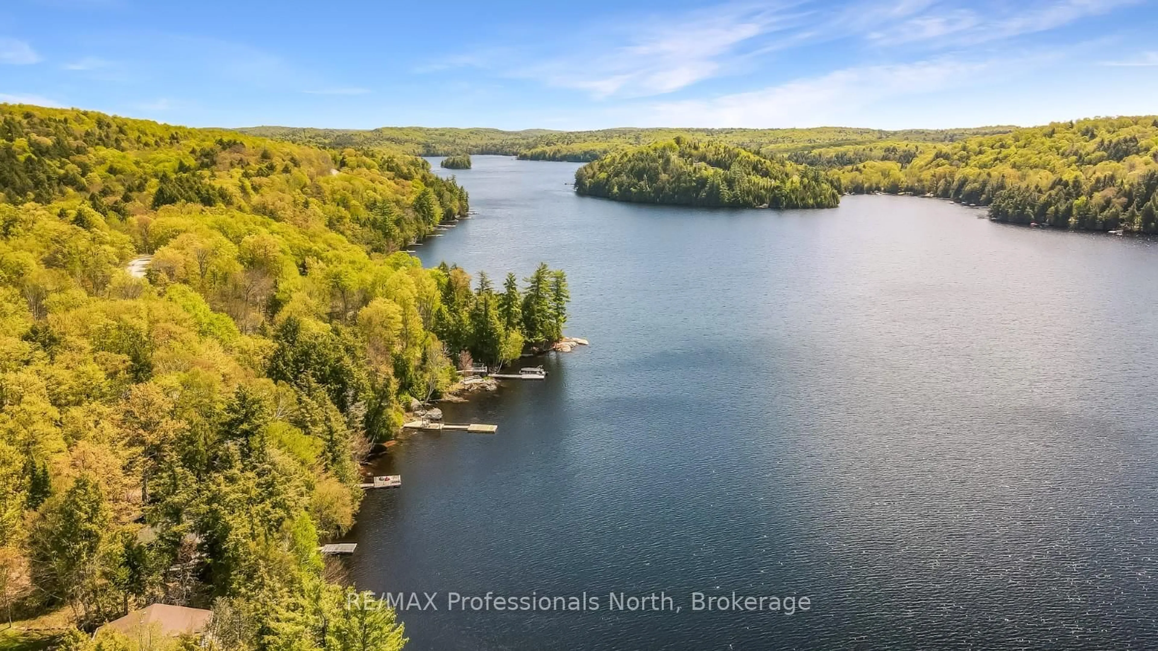 A pic from outside/outdoor area/front of a property/back of a property/a pic from drone, water/lake/river/ocean view for 1025 Huckleberry Lane, Dysart et al Ontario K0M 1S0