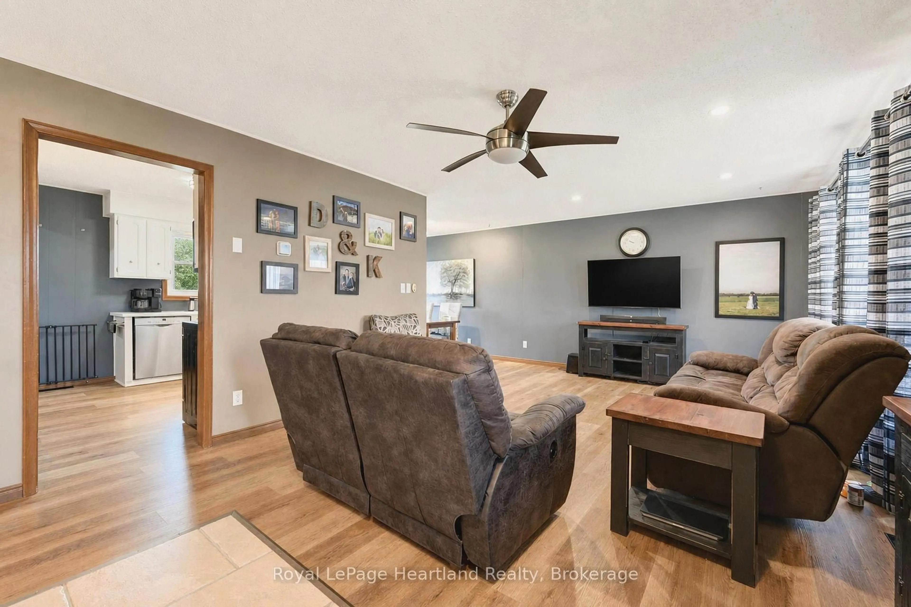 Living room with furniture, wood/laminate floor for 77292 London Rd, Huron East Ontario N0M 1L0