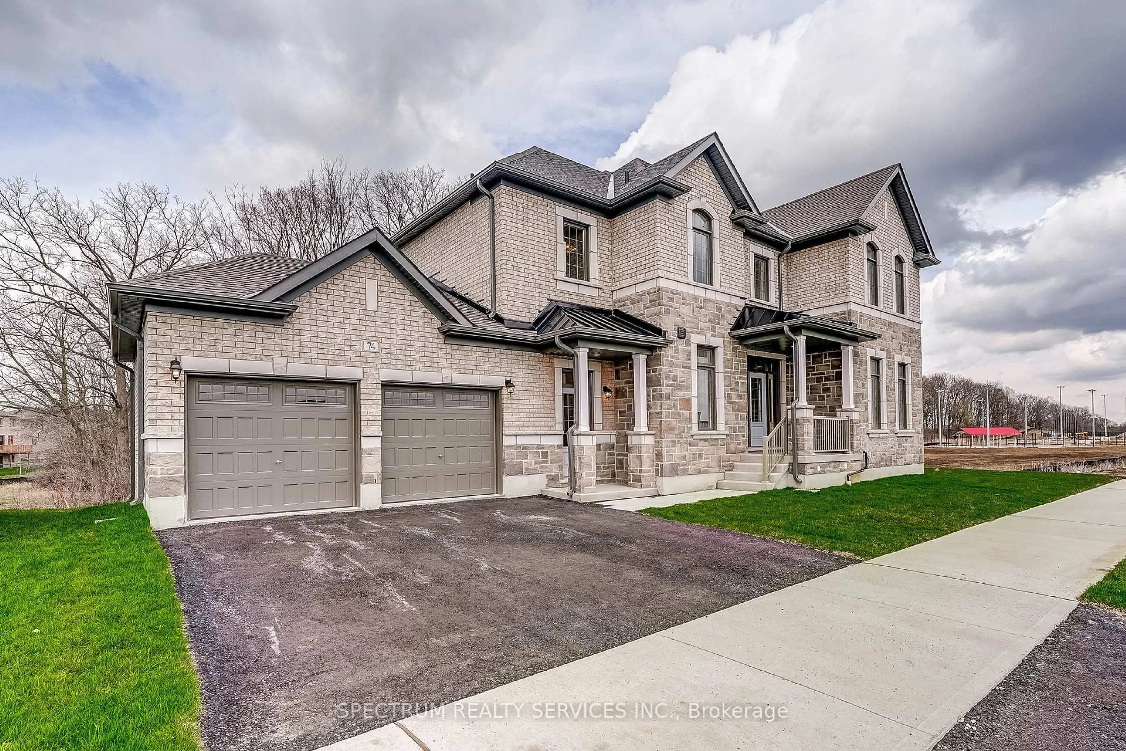 Home with brick exterior material, street for 74 Strickland Ave, Brantford Ontario N3T 0X7