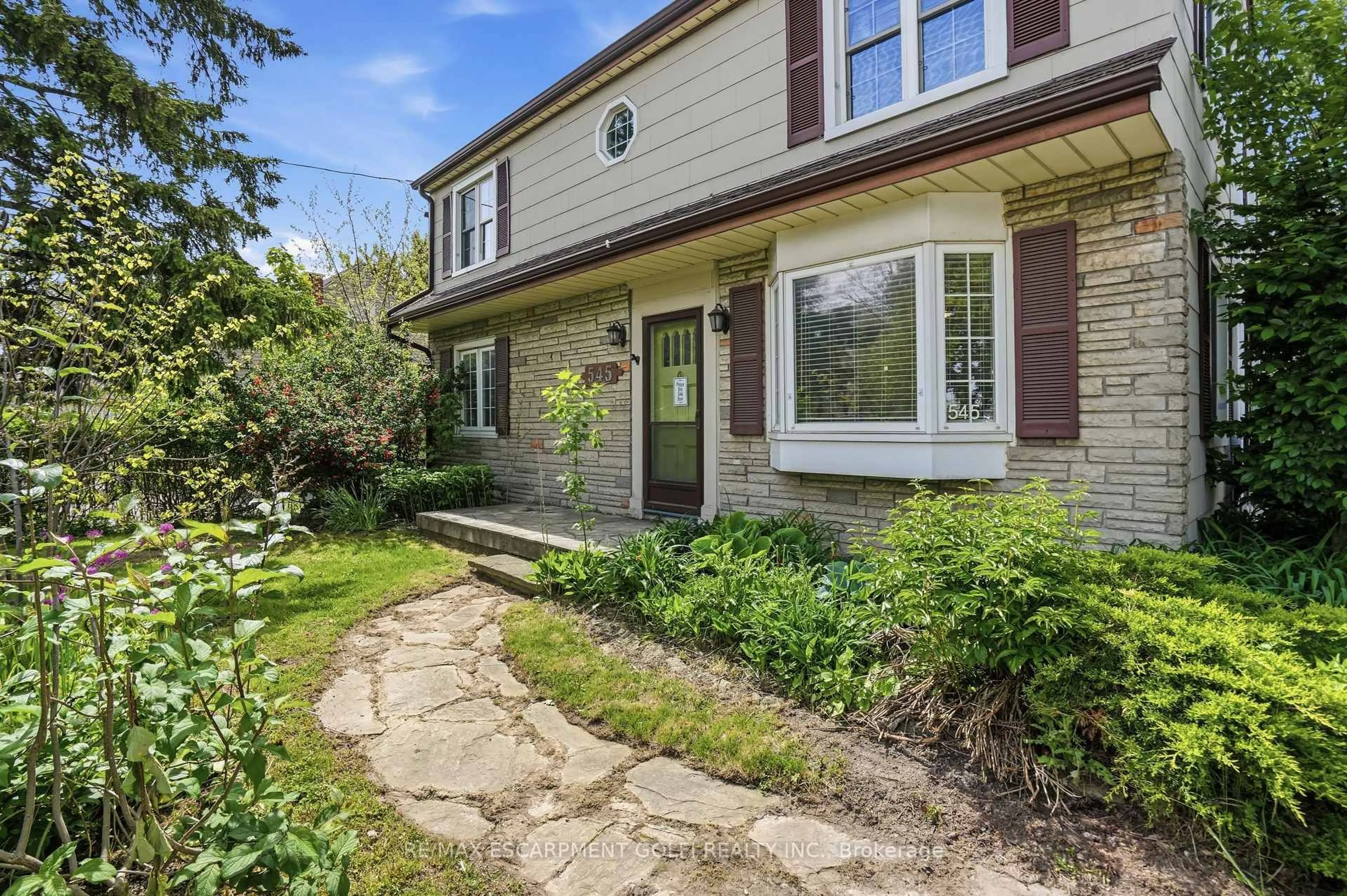 Home with brick exterior material, street for 545 Mohawk Rd, Hamilton Ontario L9C 1X5
