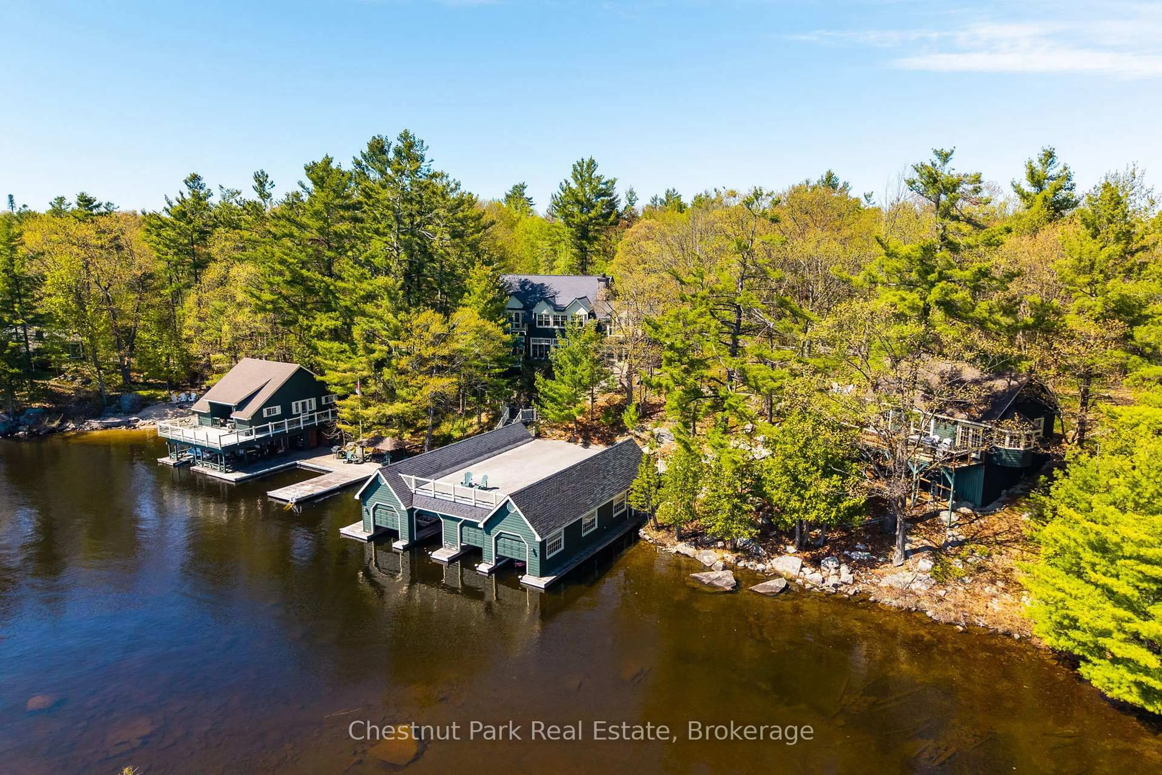 A pic from outside/outdoor area/front of a property/back of a property/a pic from drone, water/lake/river/ocean view for 1064 Heather Lodge Rd #1 & 3, Muskoka Lakes Ontario P0B 1J0
