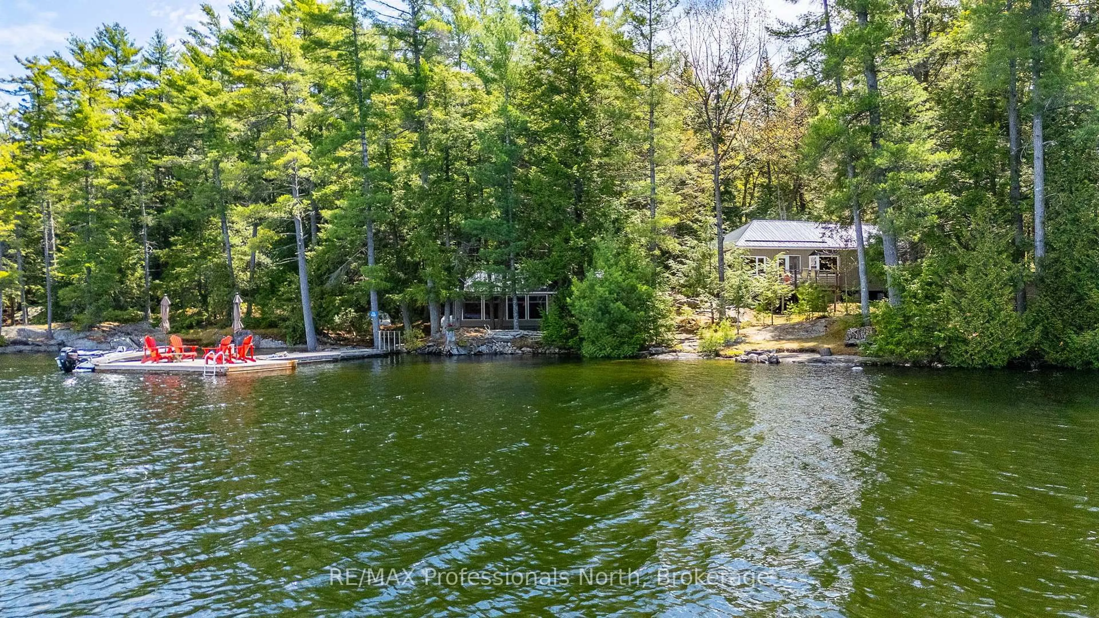 A pic from outside/outdoor area/front of a property/back of a property/a pic from drone, water/lake/river/ocean view for 54261 BIG HAWK EAST SHORE, Algonquin Highlands Ontario K0M 1J1
