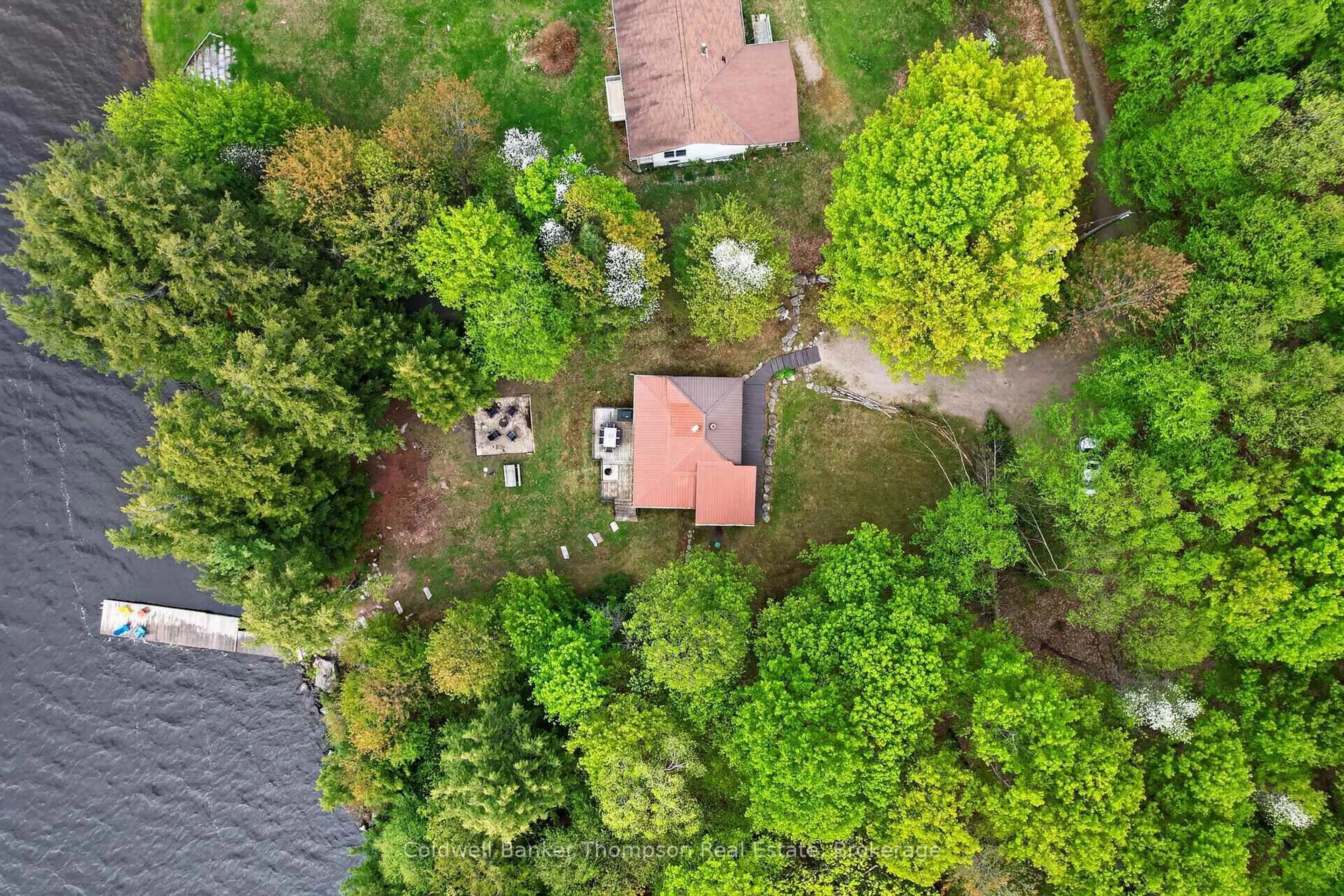 A pic from outside/outdoor area/front of a property/back of a property/a pic from drone, forest/trees view for 112 Bittern Lake Lane, Perry Ontario P0A 1R0