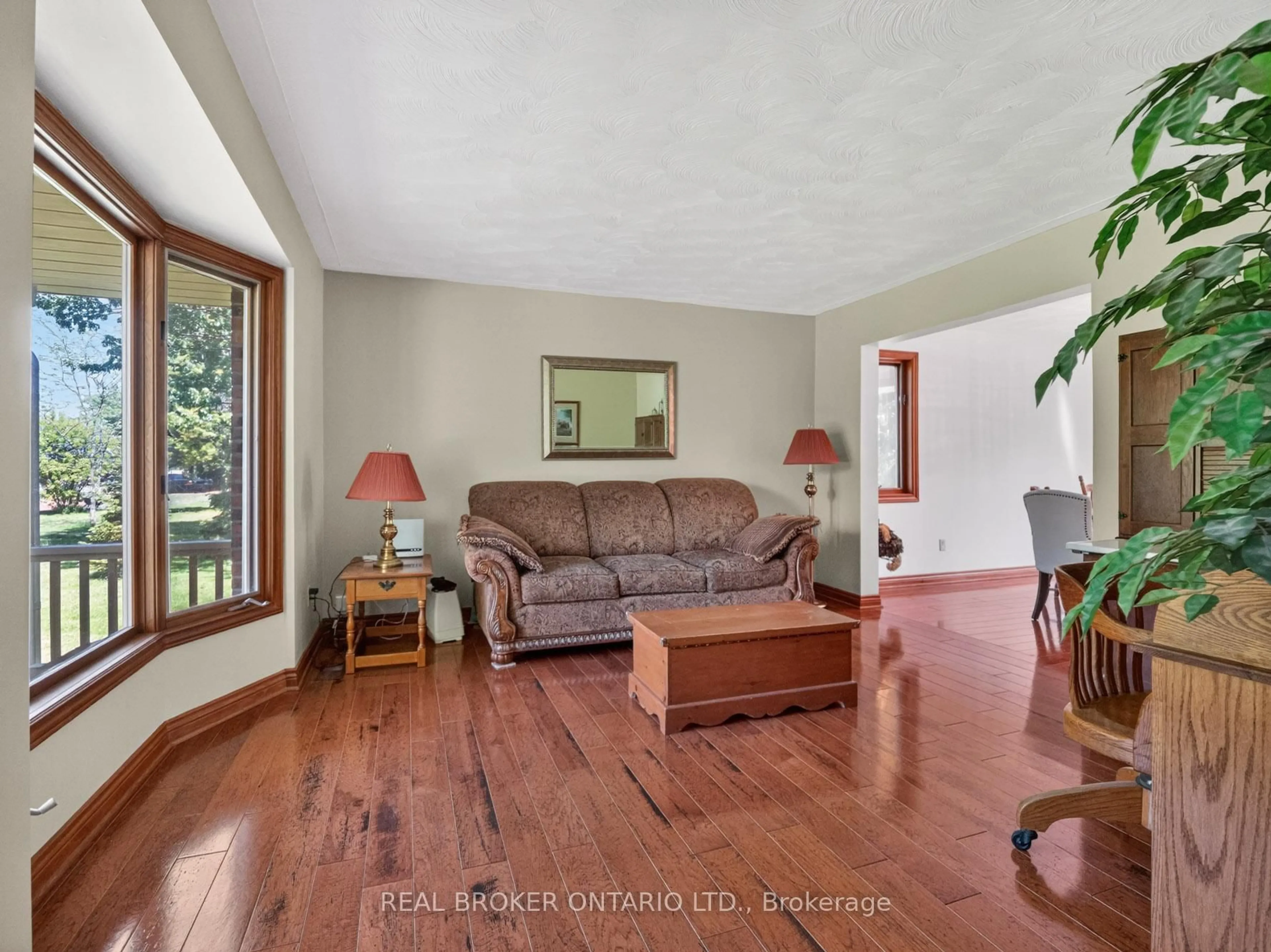 Living room with furniture, wood/laminate floor for 42965 3 Highway, Wainfleet Ontario L0S 1V0