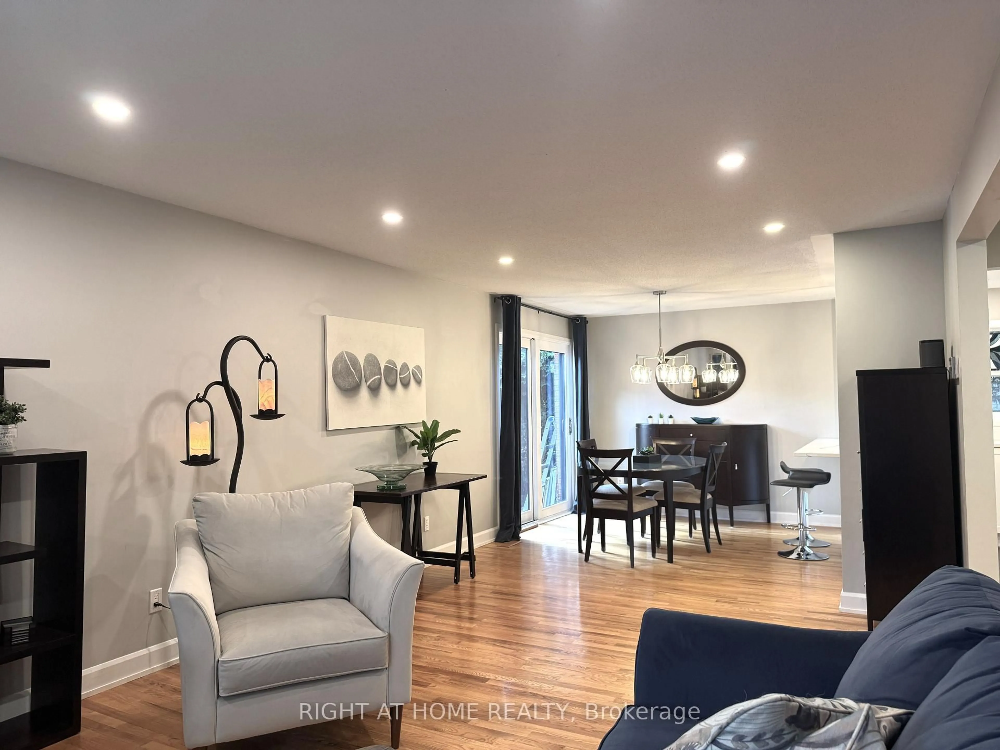 Living room with furniture, wood/laminate floor for 3 Pommel Cres, Ottawa Ontario K2M 1A3