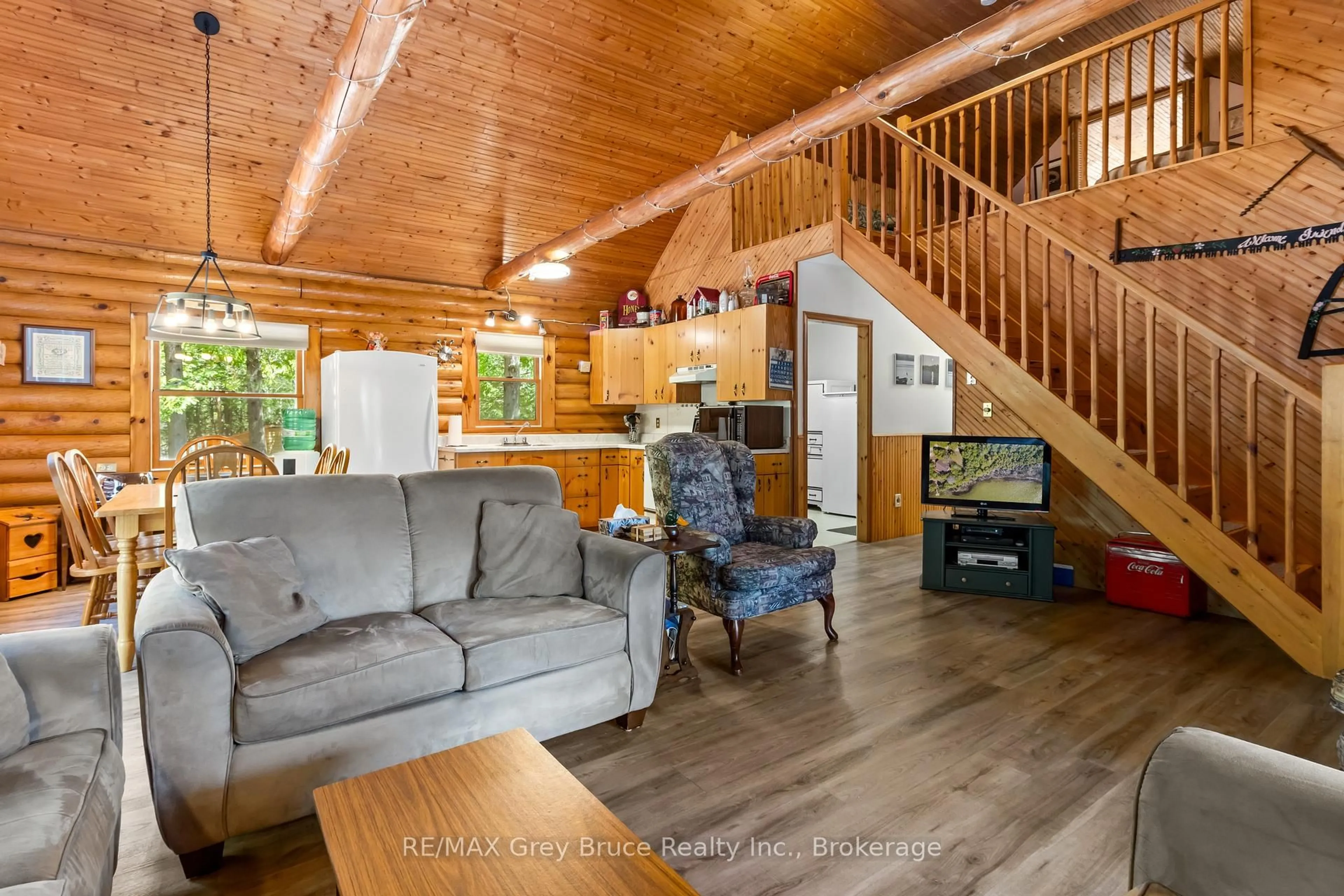 Living room with furniture, wood/laminate floor for 155 Shouldice Lake Rd, Northern Bruce Peninsula Ontario N0H 1Z0