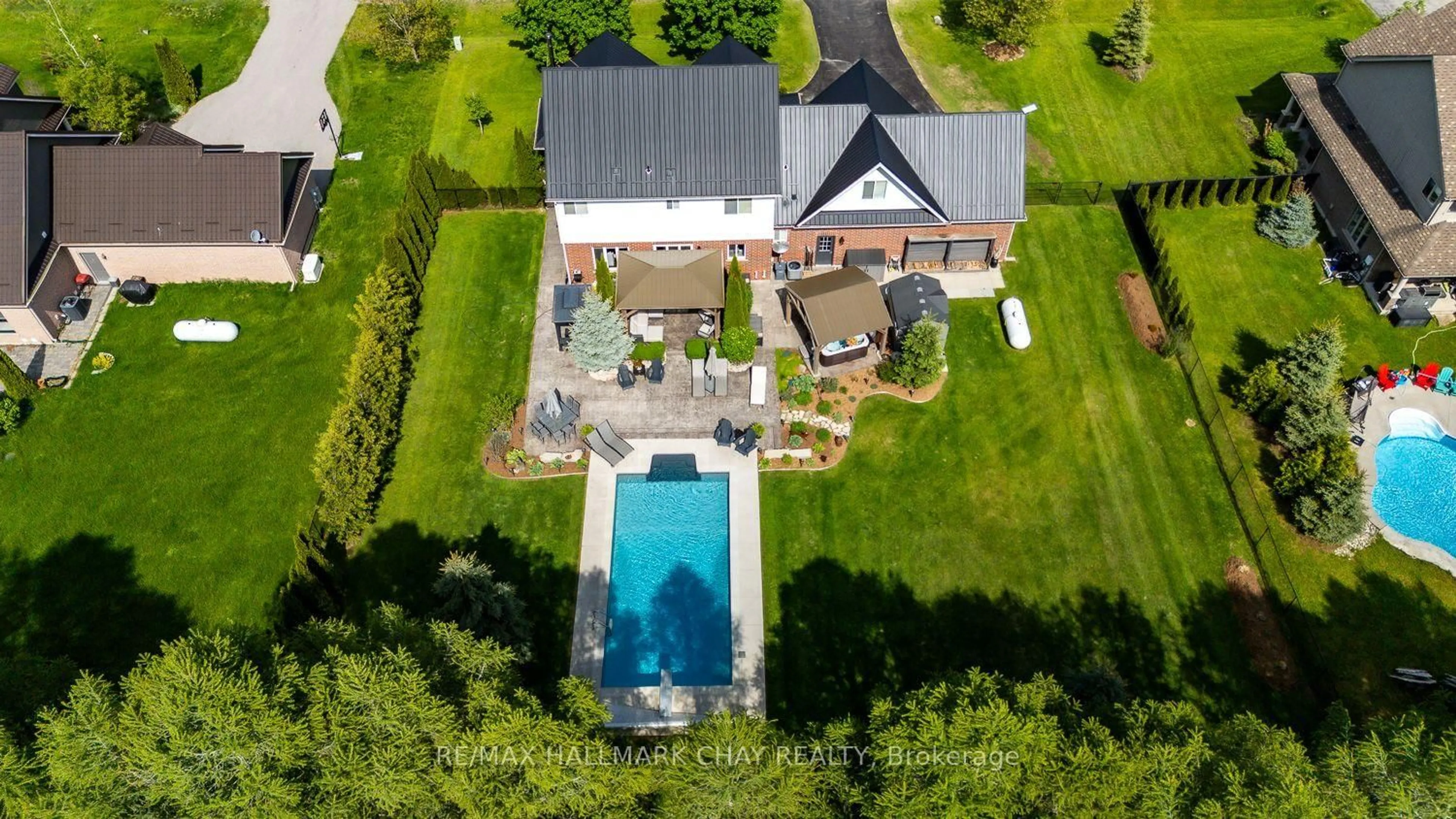 A pic from outside/outdoor area/front of a property/back of a property/a pic from drone, unknown for 23 Somerville Cres, Mulmur Ontario L9V 3J2