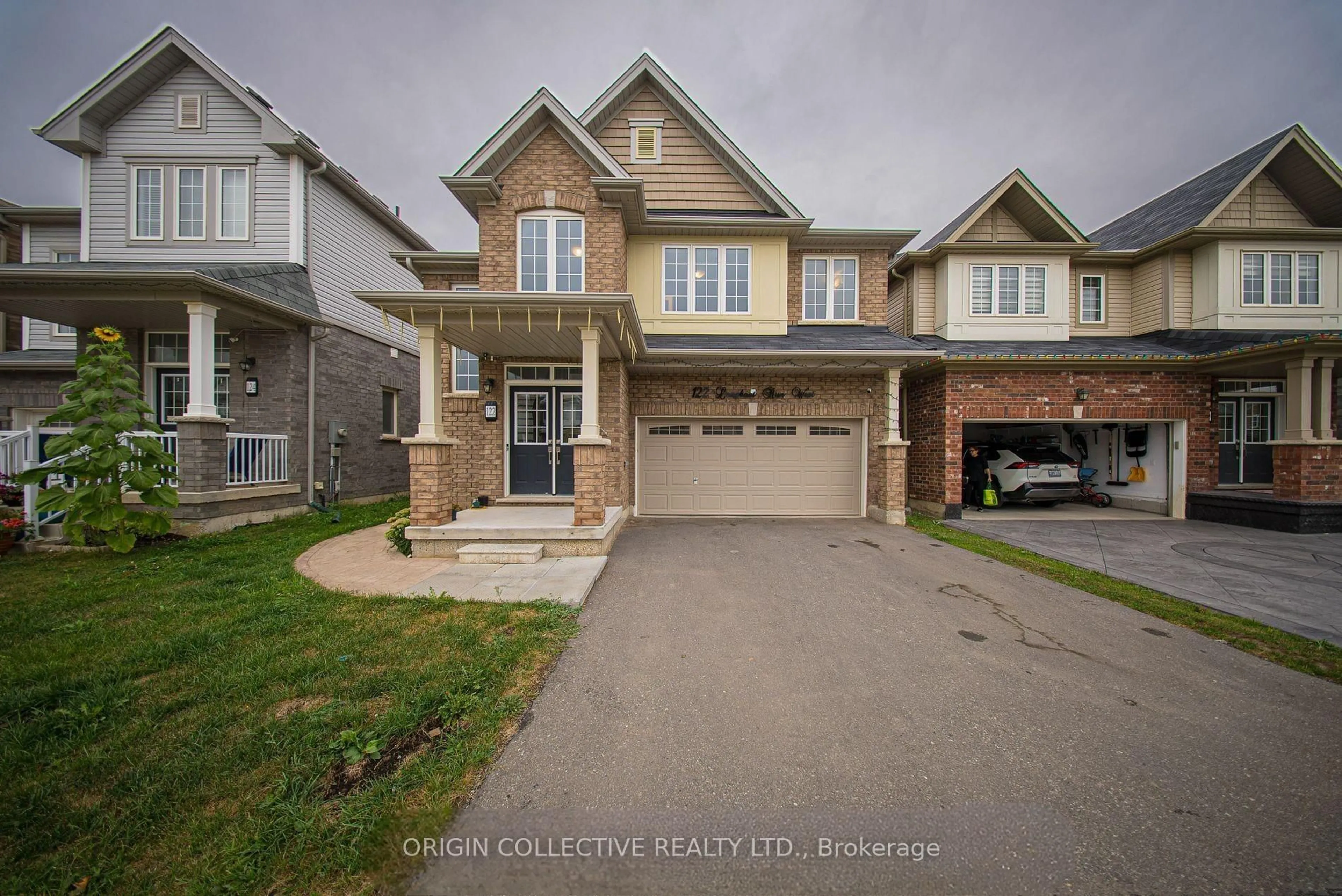 Home with brick exterior material, street for 122 Longboat Run West, Brantford Ontario N3T 0P3