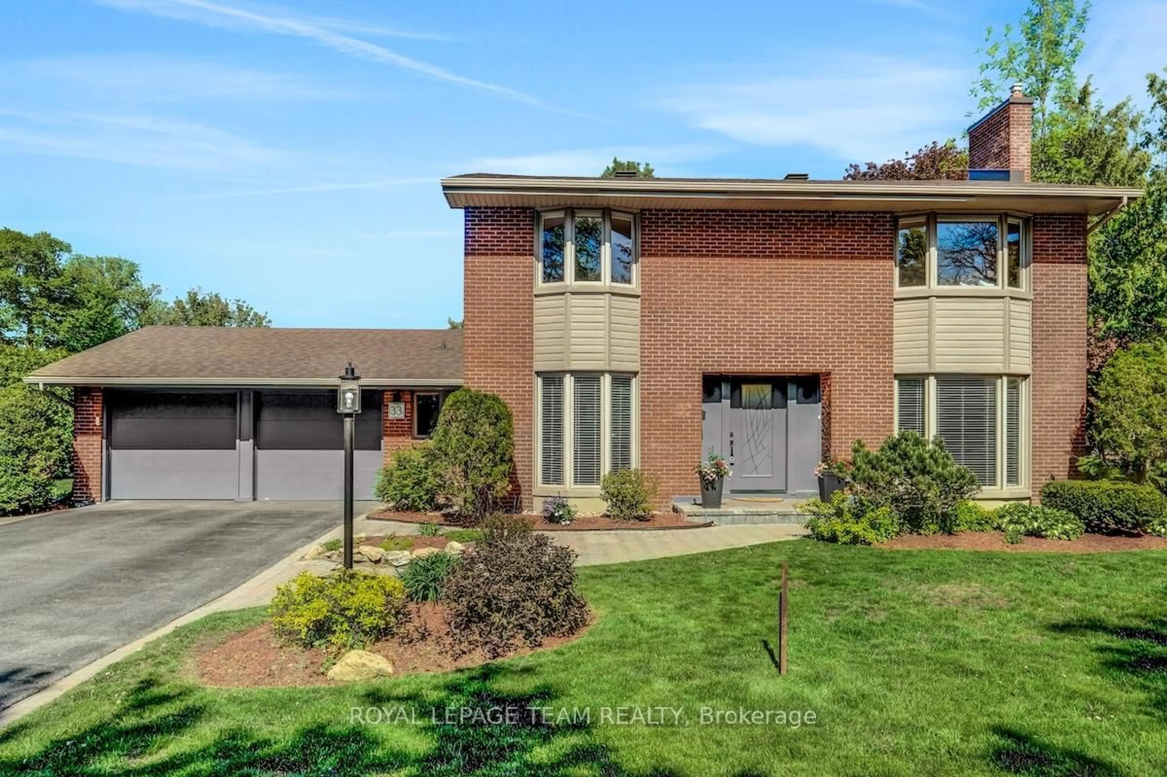 Home with brick exterior material, street for 33 Okanagan Dr, Ottawa Ontario K2H 7E9
