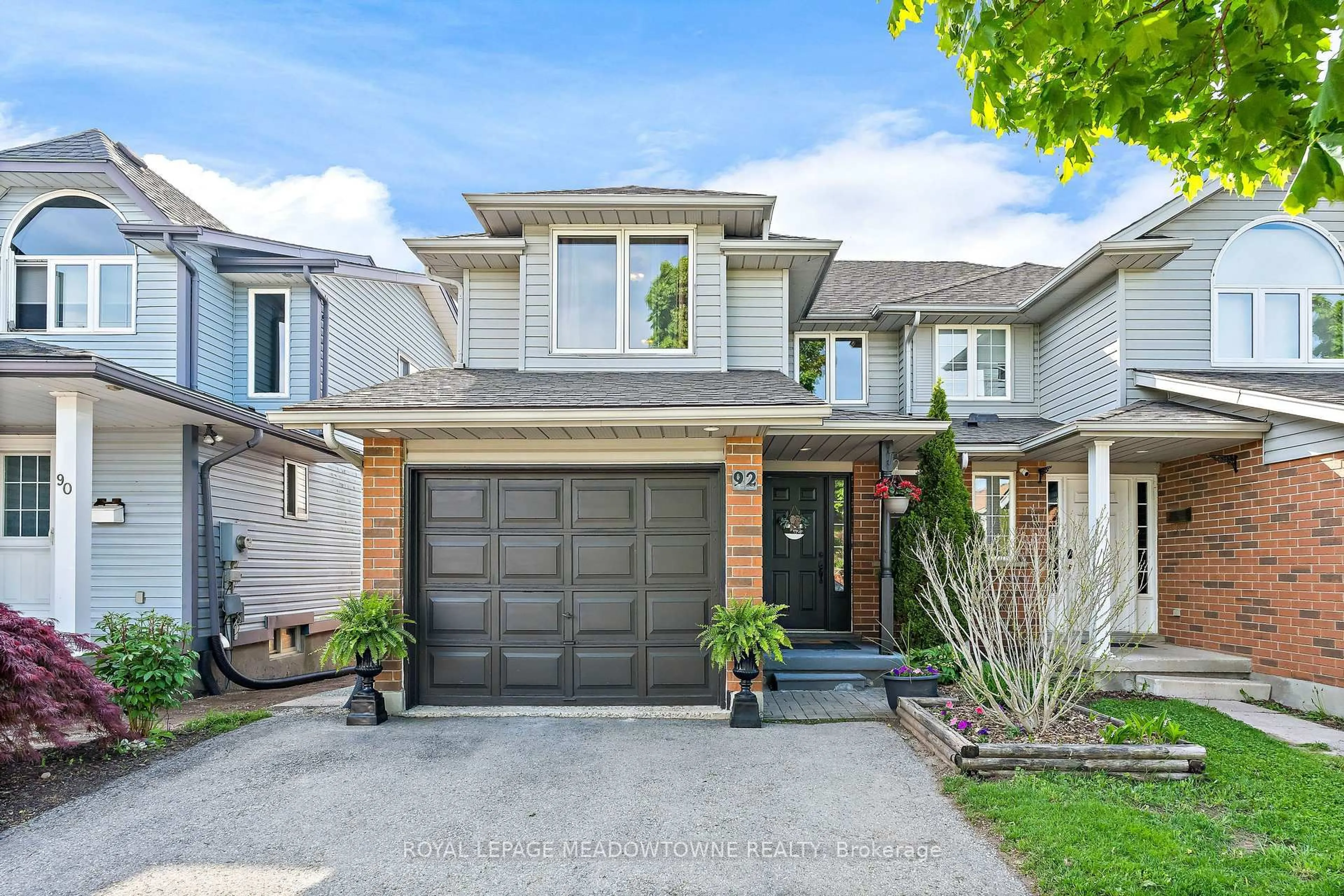 Home with brick exterior material, street for 92 Chesterton Lane, Guelph Ontario N1E 7A6
