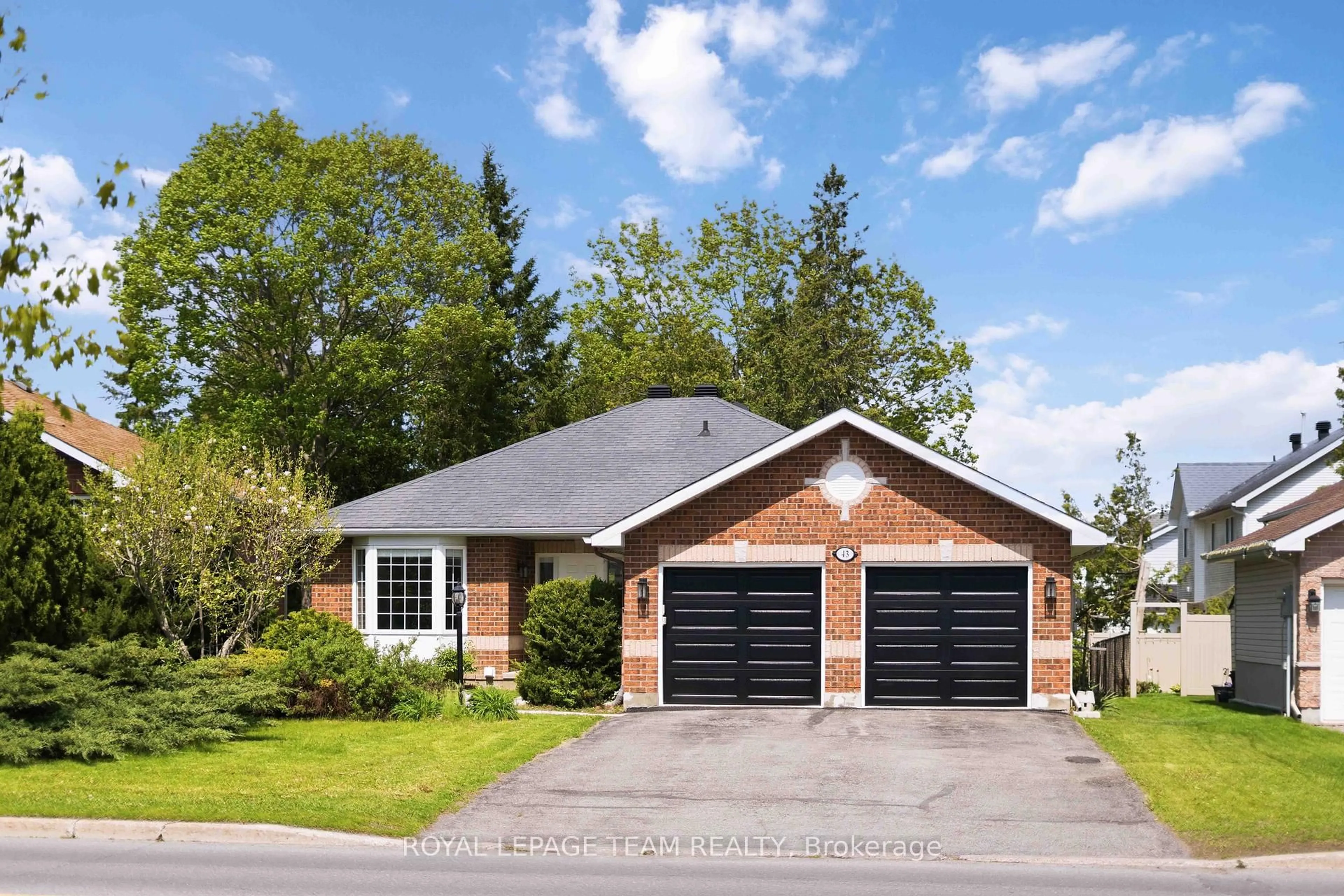 Home with brick exterior material, street for 43 West Ridge Dr, Stittsville Ontario K2S 1S4