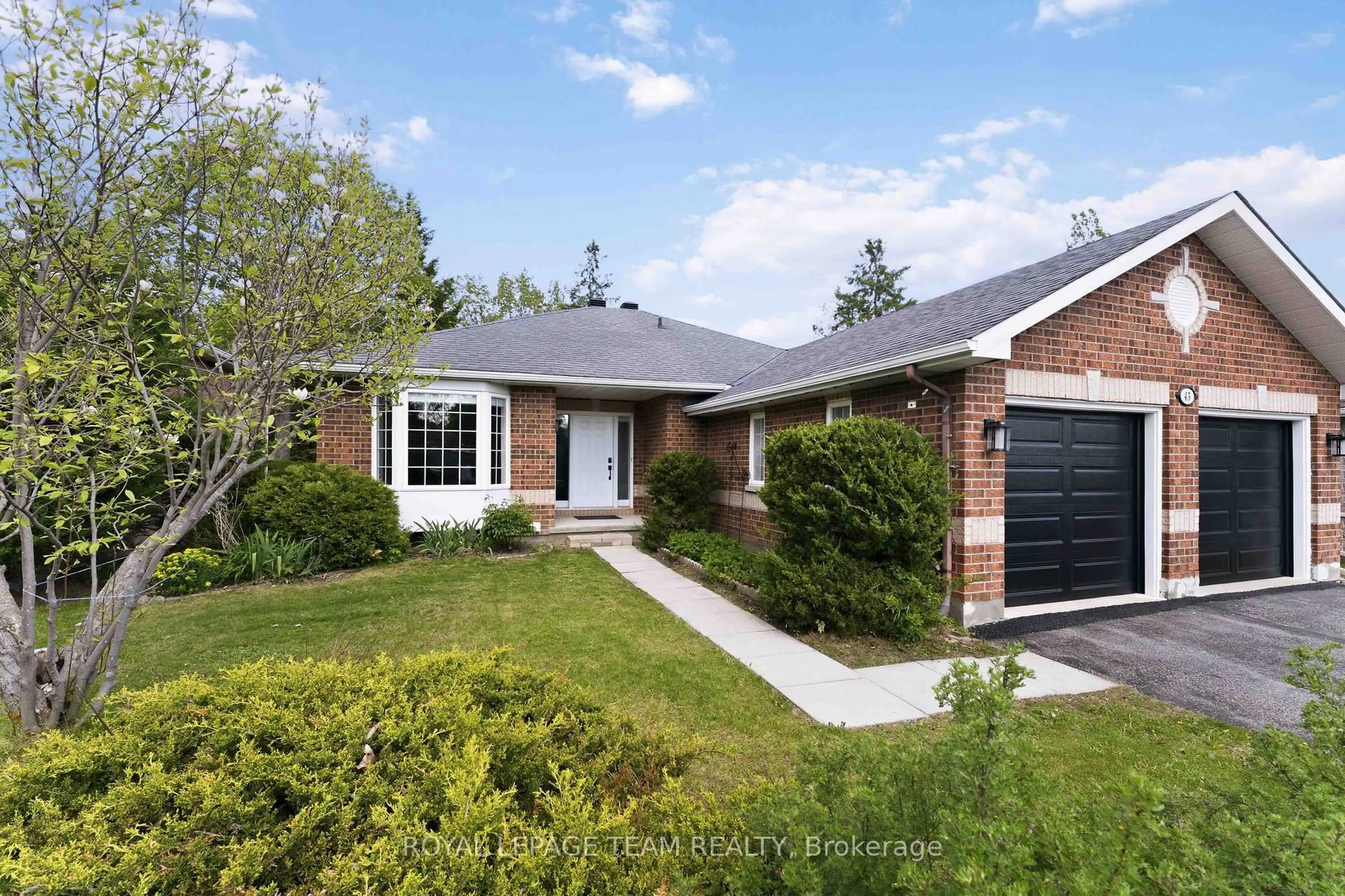 Home with brick exterior material, street for 43 West Ridge Dr, Stittsville Ontario K2S 1S4