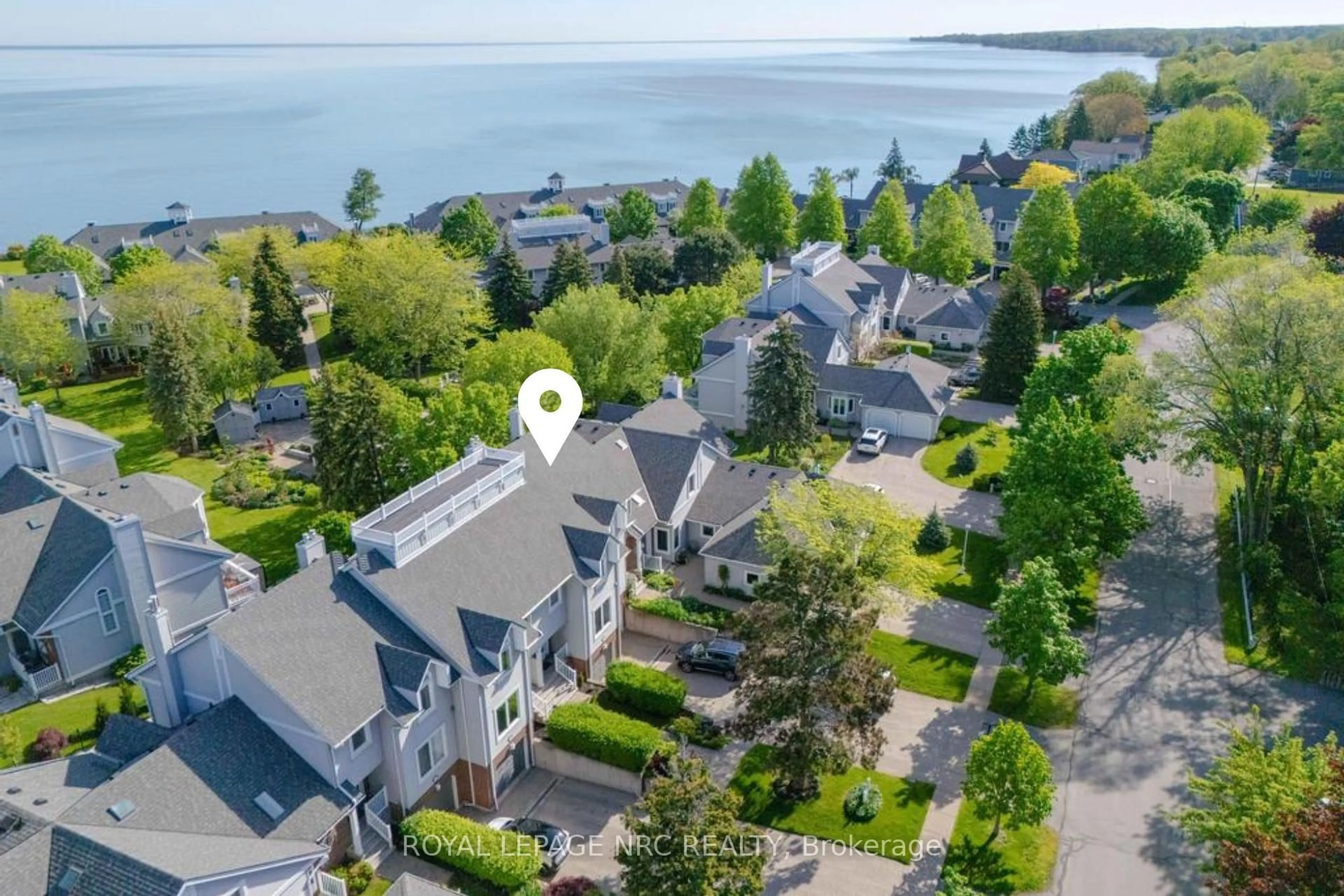 A pic from outside/outdoor area/front of a property/back of a property/a pic from drone, water/lake/river/ocean view for 1 Lakeside Dr #13, St. Catharines Ontario L2M 1P3