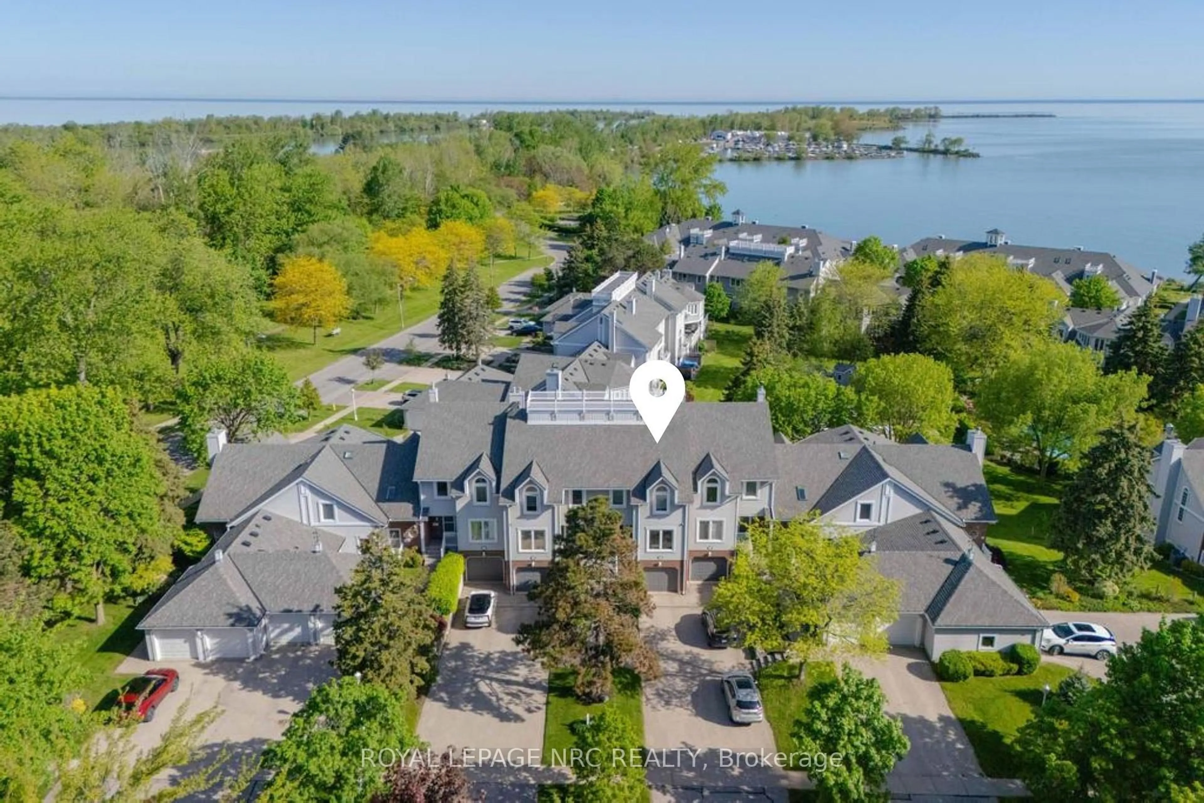 A pic from outside/outdoor area/front of a property/back of a property/a pic from drone, water/lake/river/ocean view for 1 Lakeside Dr #13, St. Catharines Ontario L2M 1P3