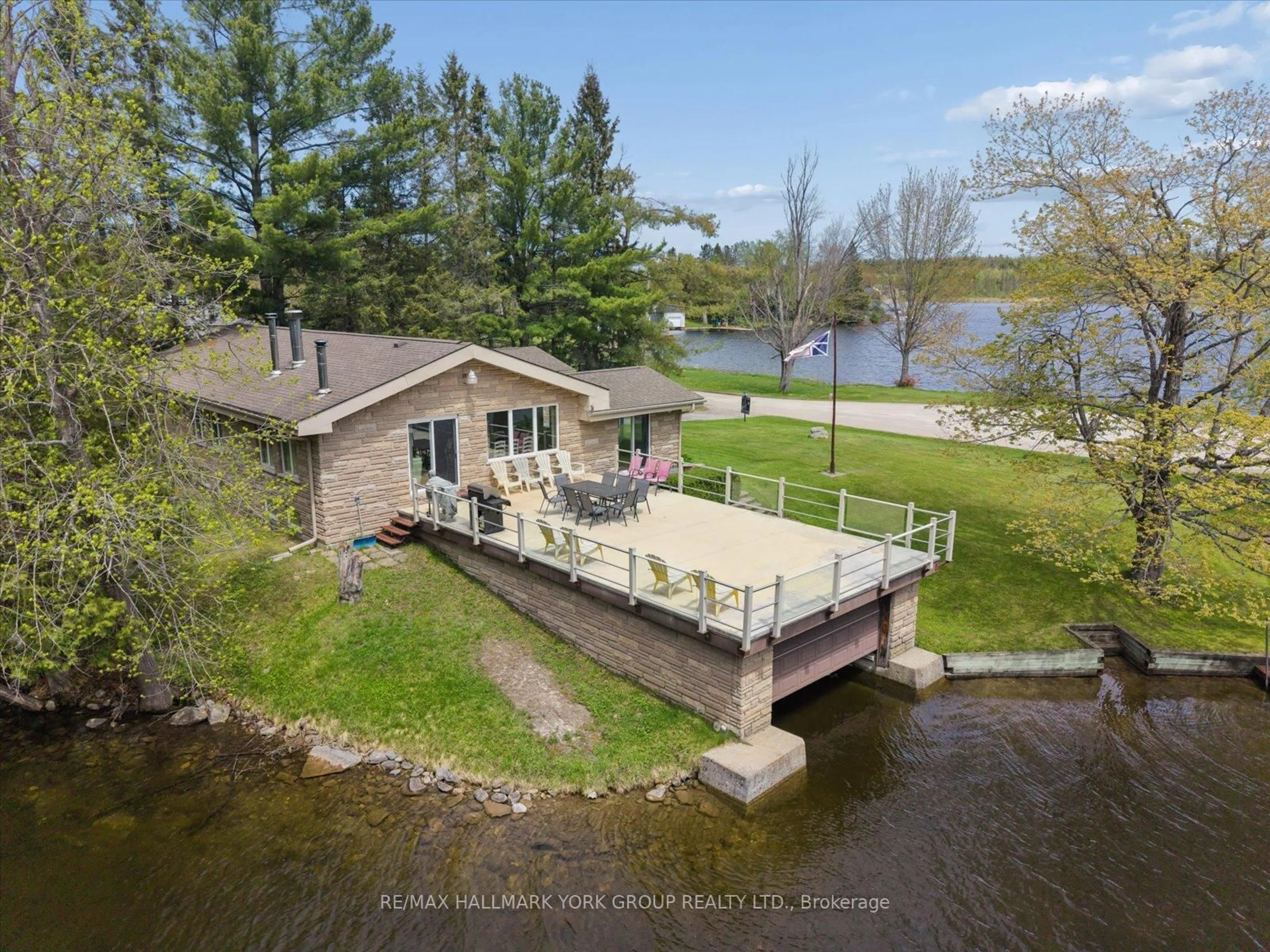 A pic from outside/outdoor area/front of a property/back of a property/a pic from drone, water/lake/river/ocean view for 102 Albert St, Kawartha Lakes Ontario K0M 1K0