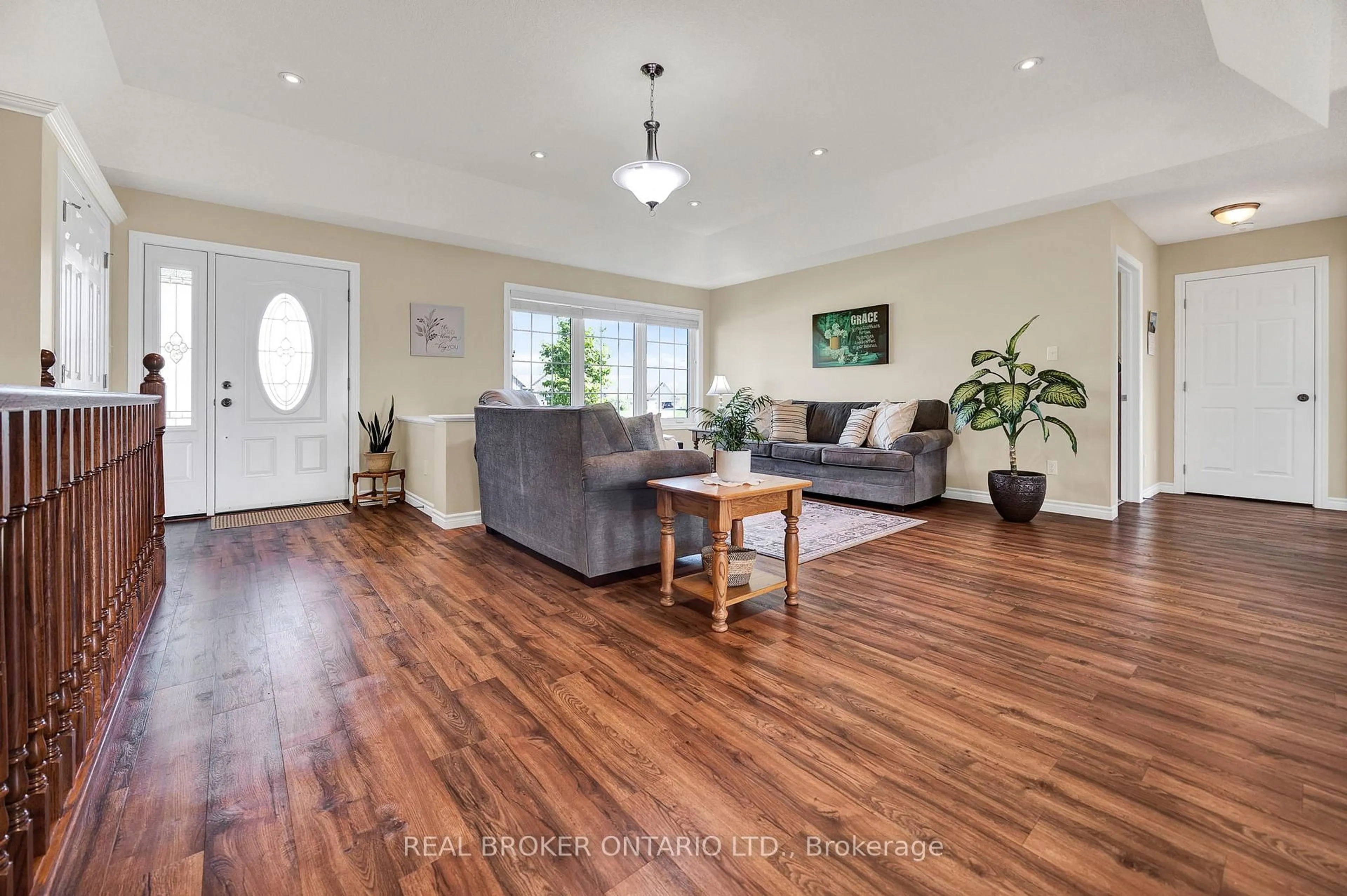 Living room with furniture, wood/laminate floor for 7826 Colonial Dr, Perth East Ontario N4W 3G9