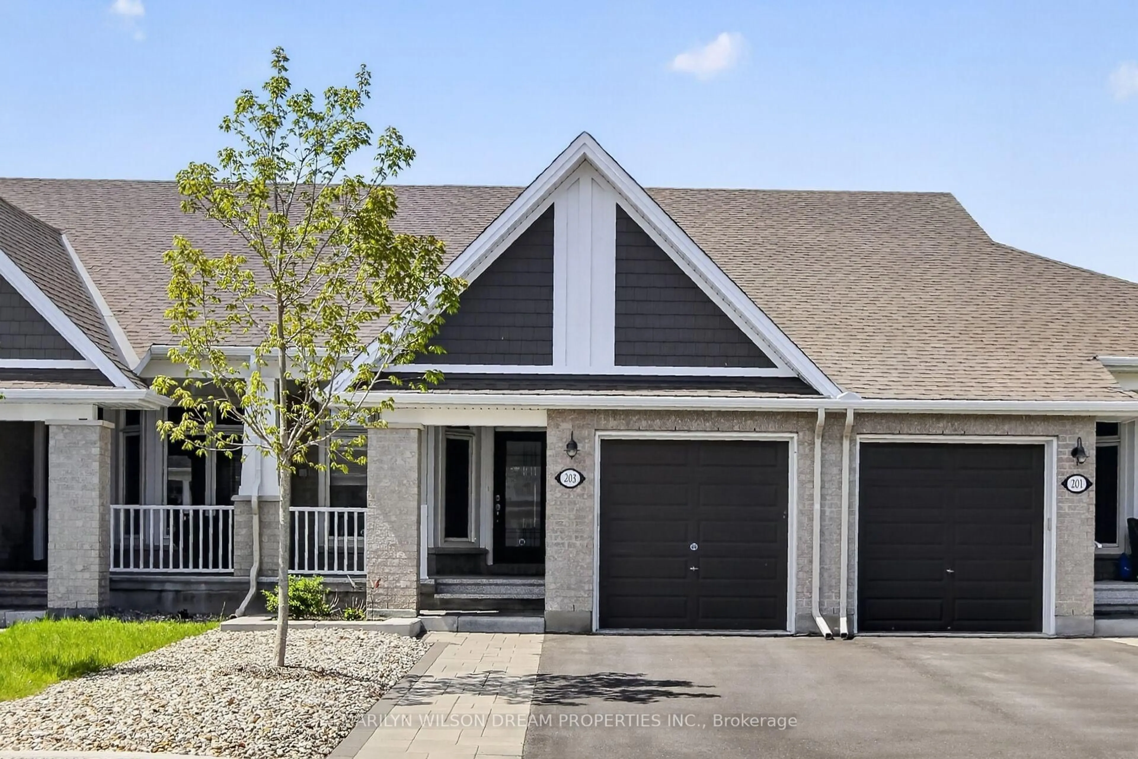 Home with vinyl exterior material, street for 203 Maygrass Way, Stittsville Ontario K2S 2K5