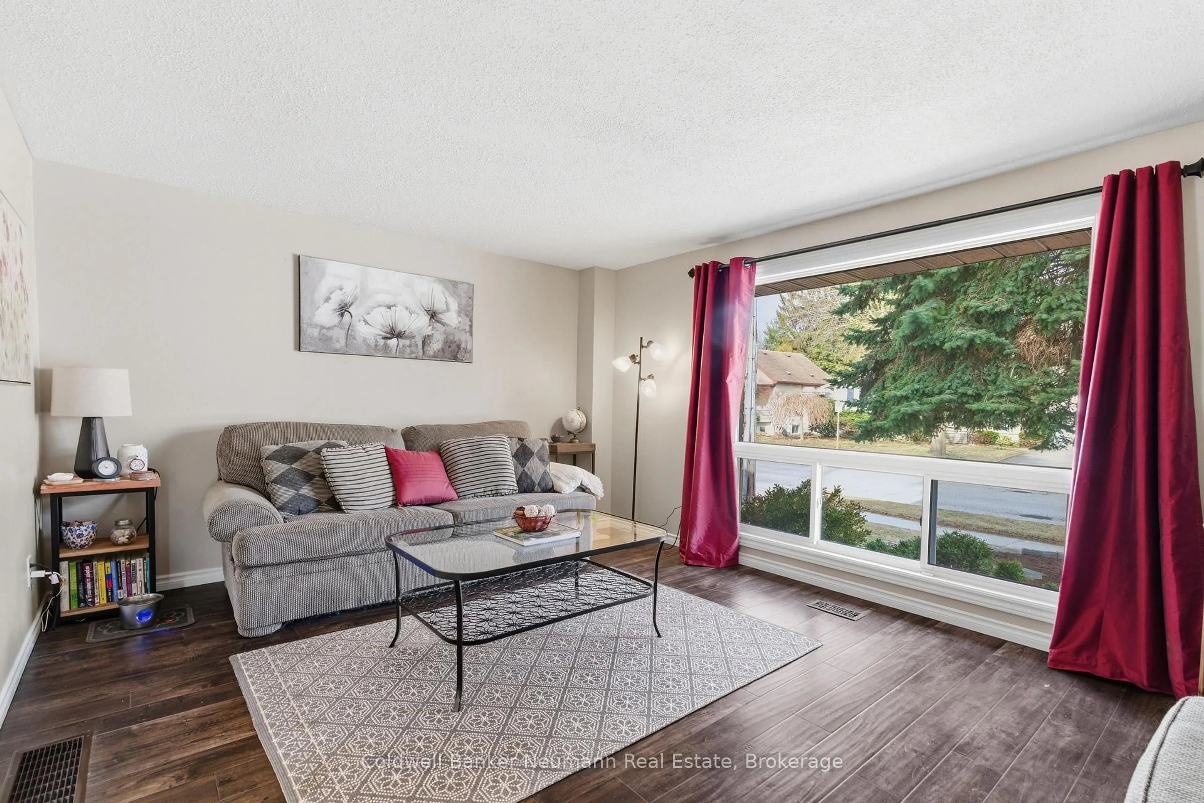 Living room with furniture, wood/laminate floor for 99 Emma St, Guelph Ontario N1E 1V1