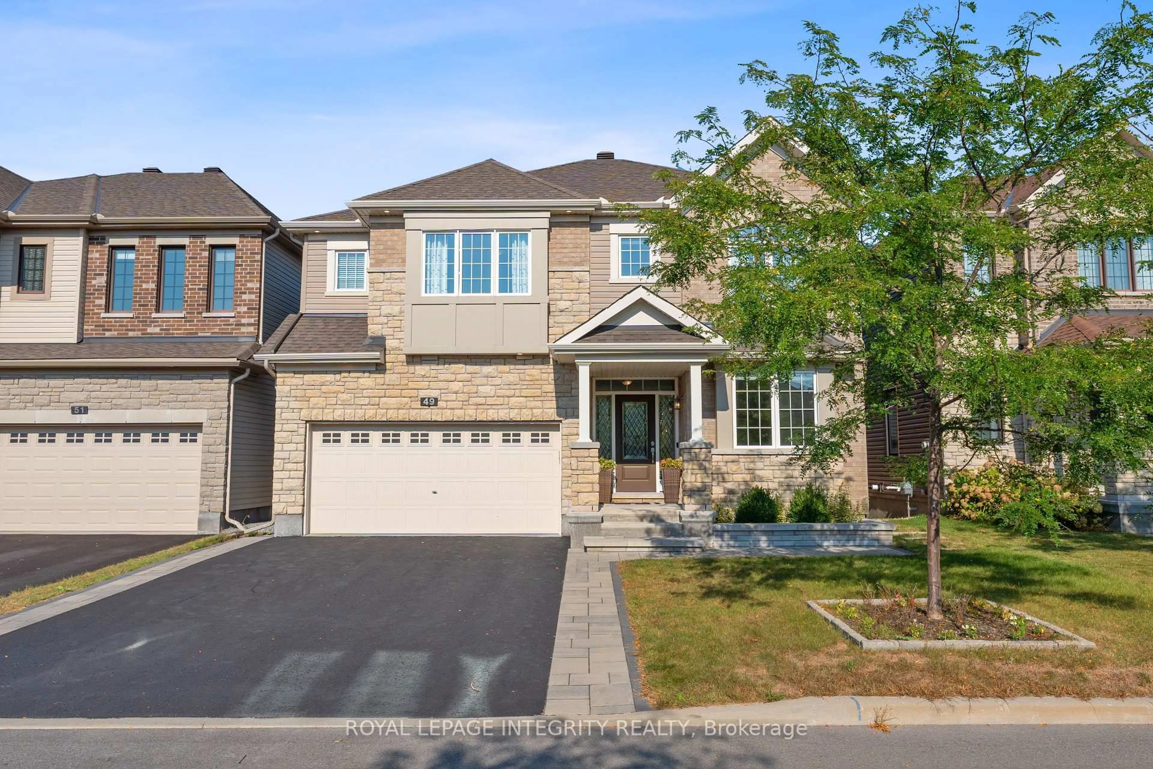 Home with brick exterior material, street for 49 Hawks Landing Cres, Stittsville Ontario K2S 1W1