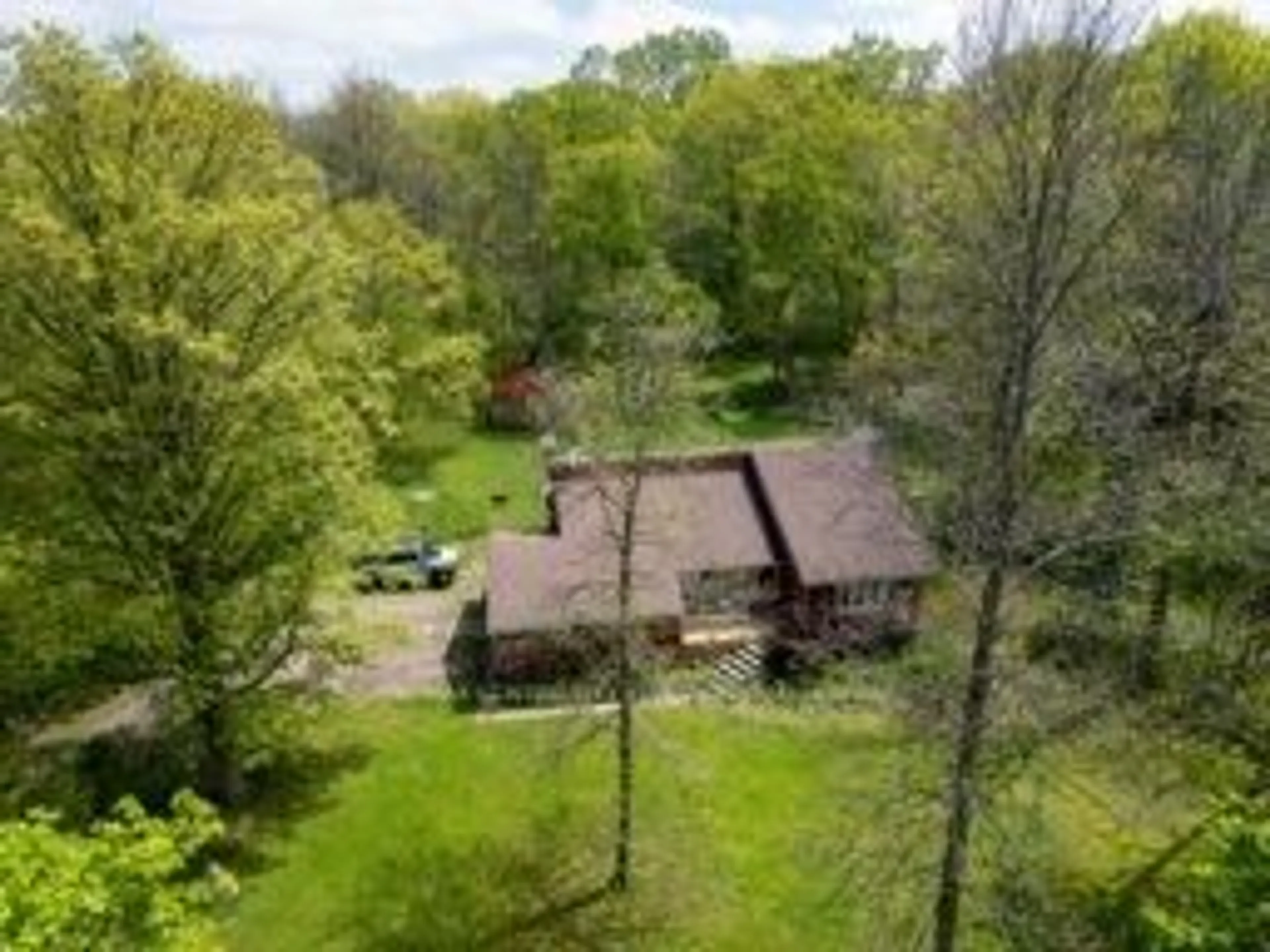 A pic from outside/outdoor area/front of a property/back of a property/a pic from drone, forest/trees view for 26046 Kerwood Rd, Adelaide Metcalfe Ontario N7G 3H5