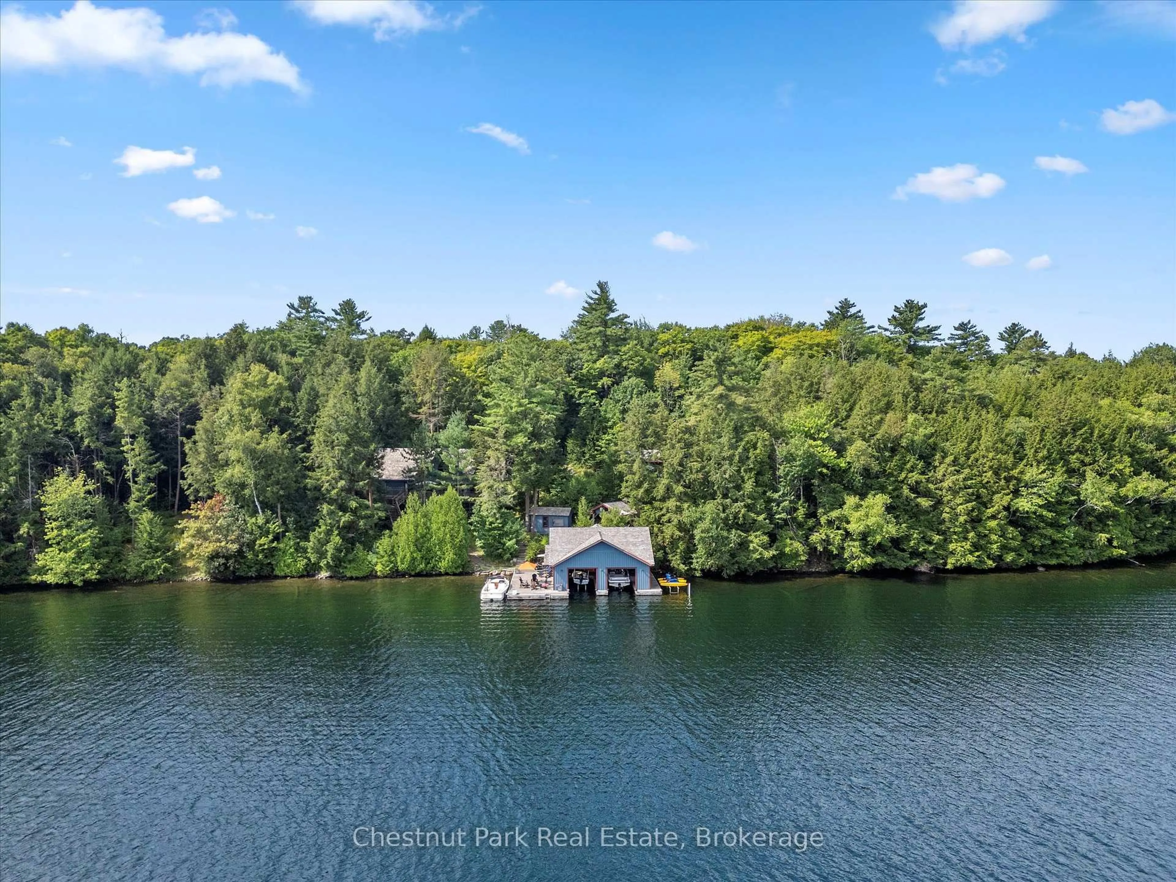 A pic from outside/outdoor area/front of a property/back of a property/a pic from drone, water/lake/river/ocean view for 12 Playfair Island # 3 Island, Seguin Ontario P0C 1H0