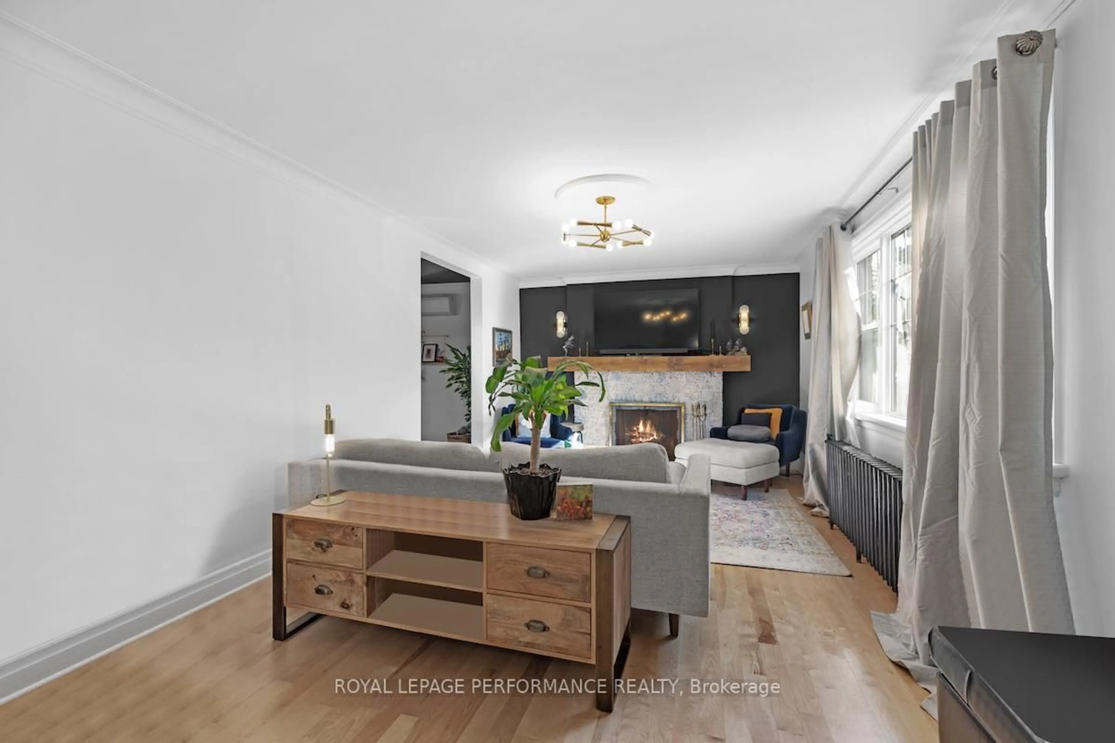 Living room with furniture, wood/laminate floor for 81 Ivy Cres, Ottawa Ontario K1M 1Y1