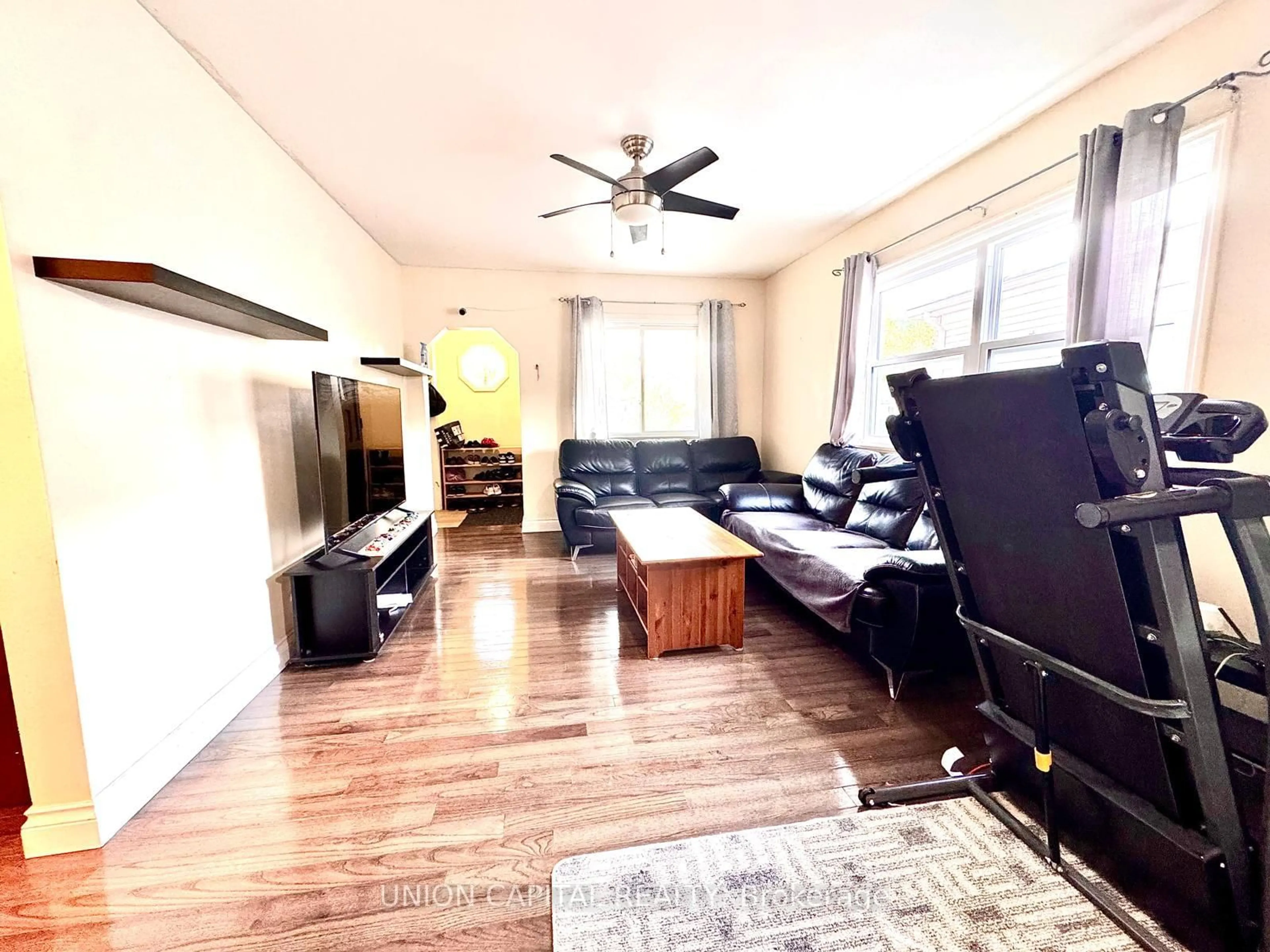 Living room with furniture, wood/laminate floor for 16 Cumming St, St. Catharines Ontario L2S 1H7