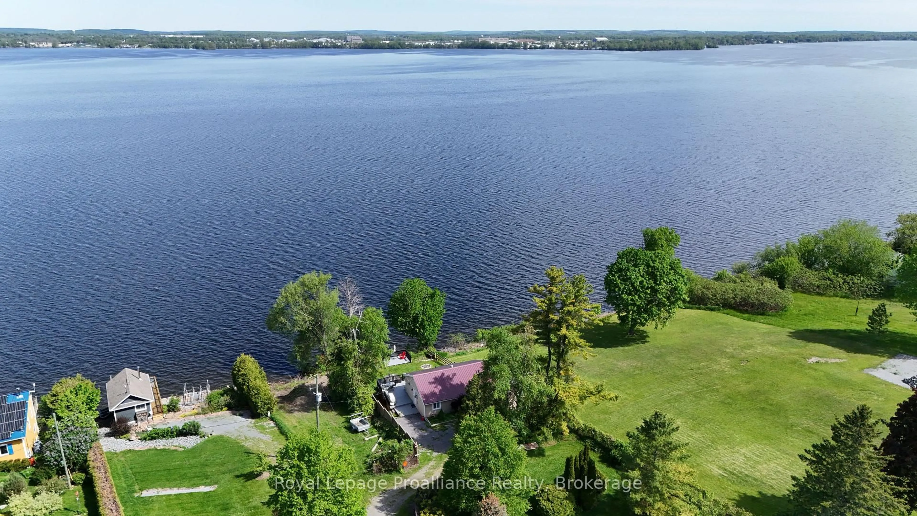 A pic from outside/outdoor area/front of a property/back of a property/a pic from drone, water/lake/river/ocean view for 20 Bonter's Lane, Prince Edward County Ontario K0K 1L0
