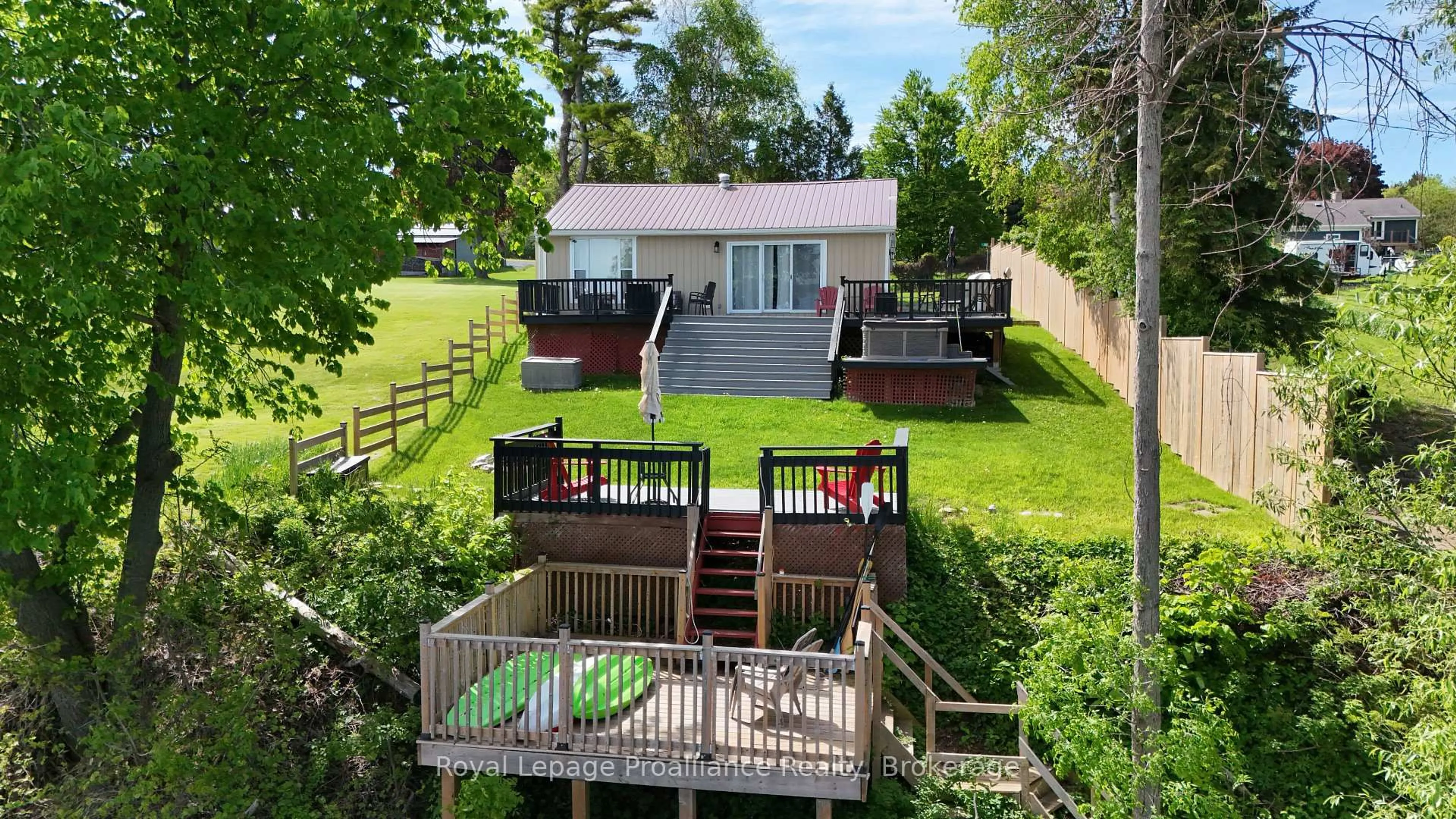 A pic from outside/outdoor area/front of a property/back of a property/a pic from drone, water/lake/river/ocean view for 20 Bonter's Lane, Prince Edward County Ontario K0K 1L0