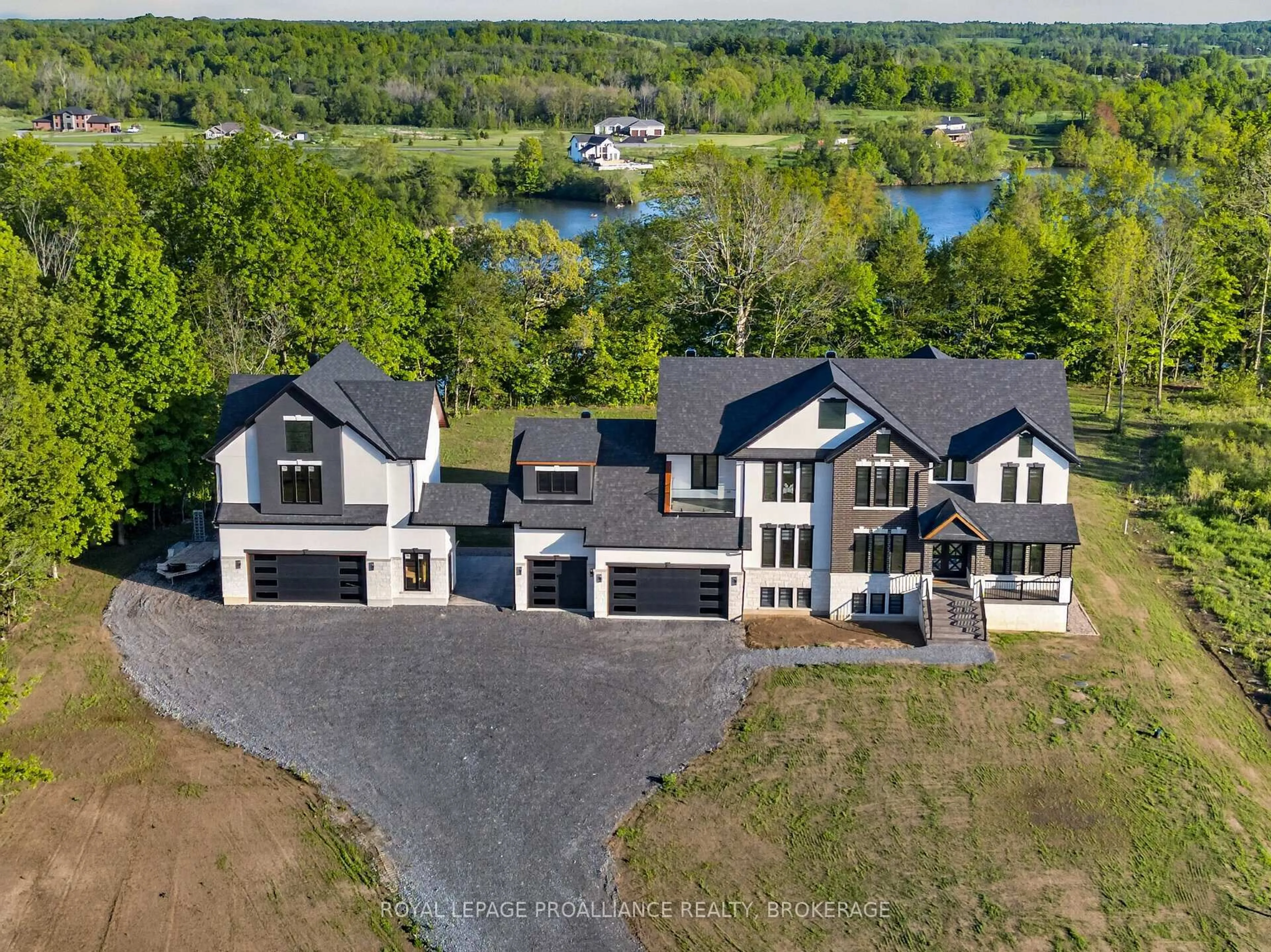 A pic from outside/outdoor area/front of a property/back of a property/a pic from drone, water/lake/river/ocean view for 2383 Isle of Man Rd, Kingston Ontario K7L 4V3