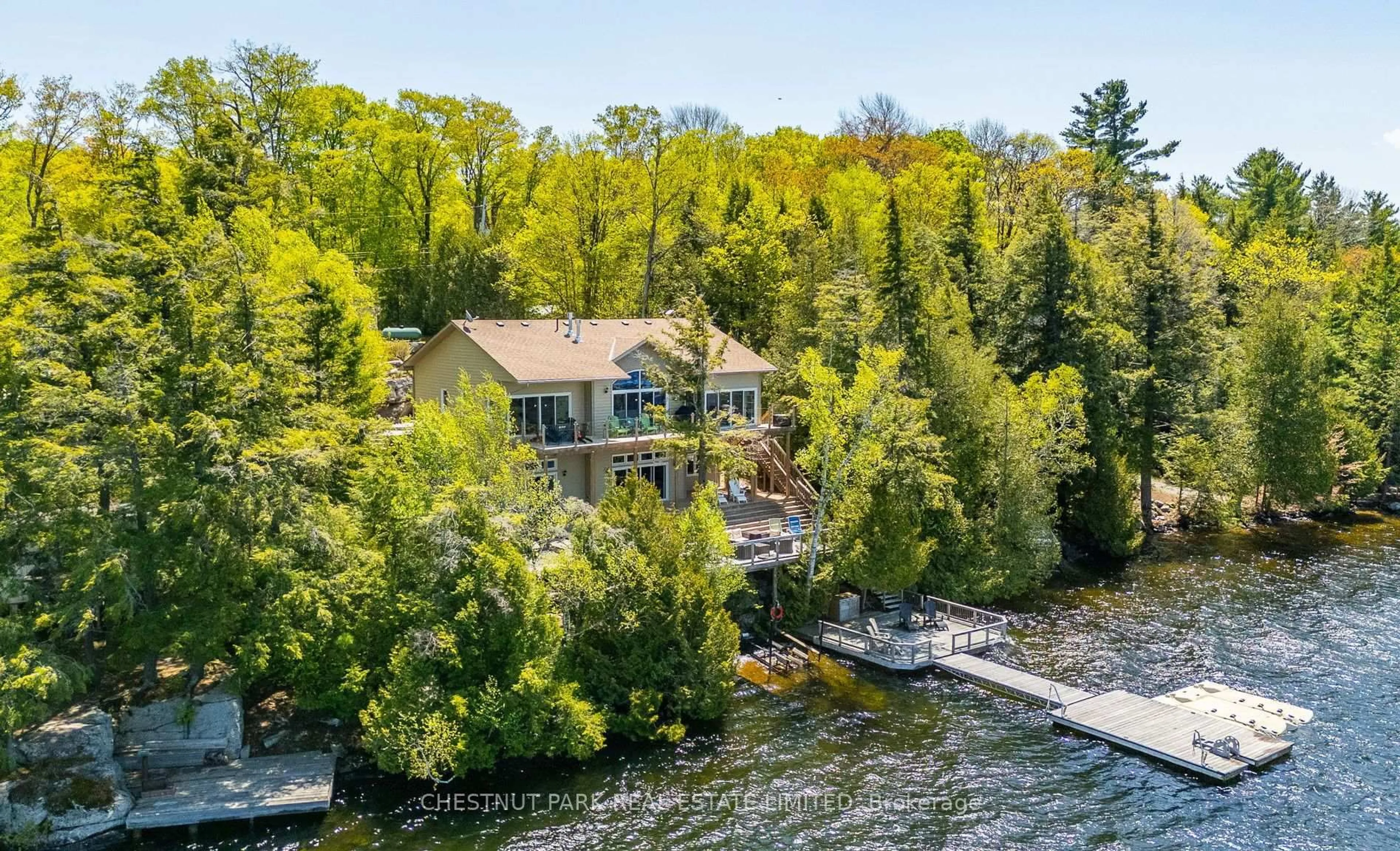 A pic from outside/outdoor area/front of a property/back of a property/a pic from drone, water/lake/river/ocean view for 2066 Wilkinson Rd, Dysart et al Ontario K0M 1S0