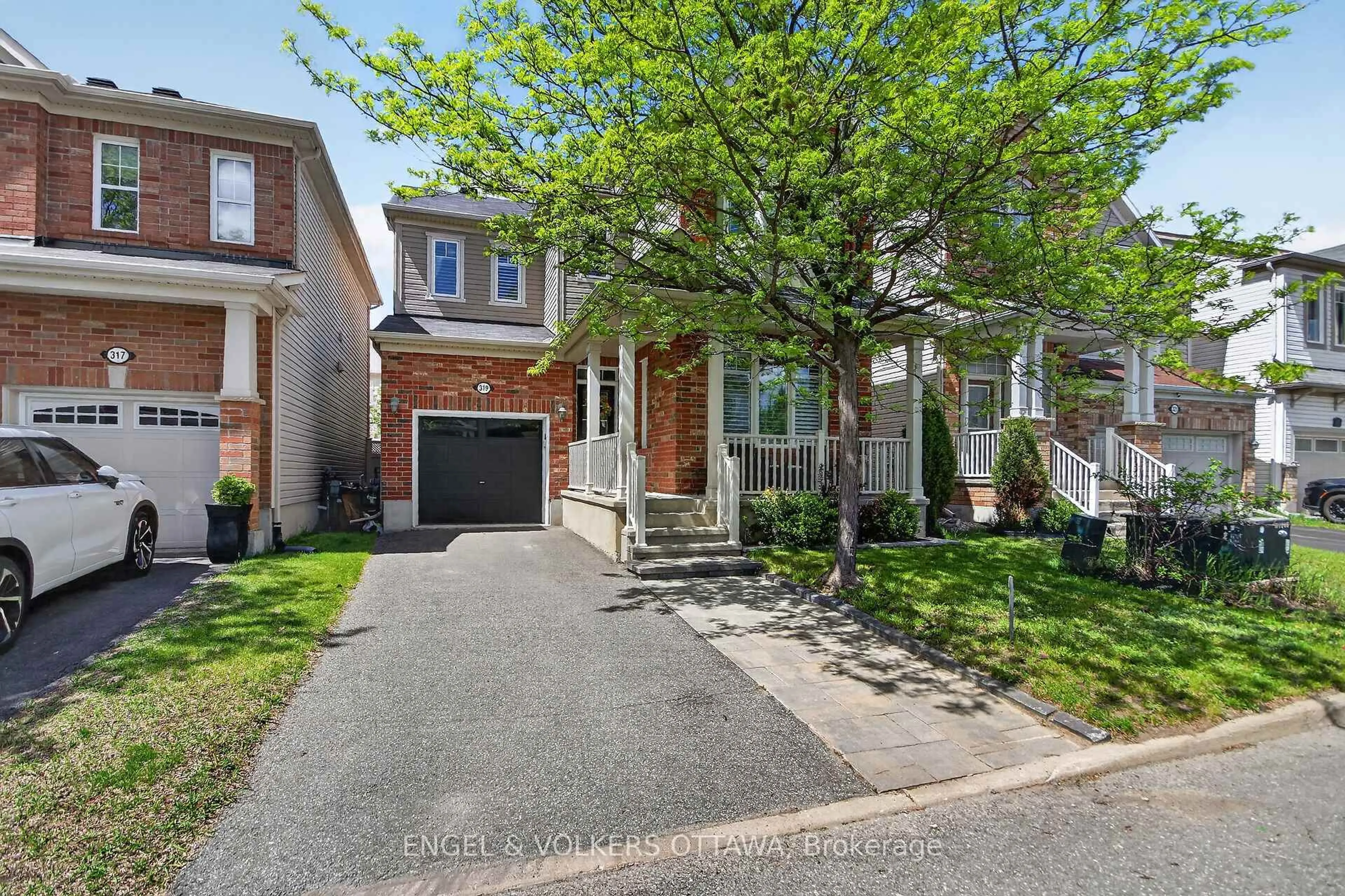 Home with brick exterior material, street for 319 River Landing Ave, Ottawa Ontario K2J 3V4