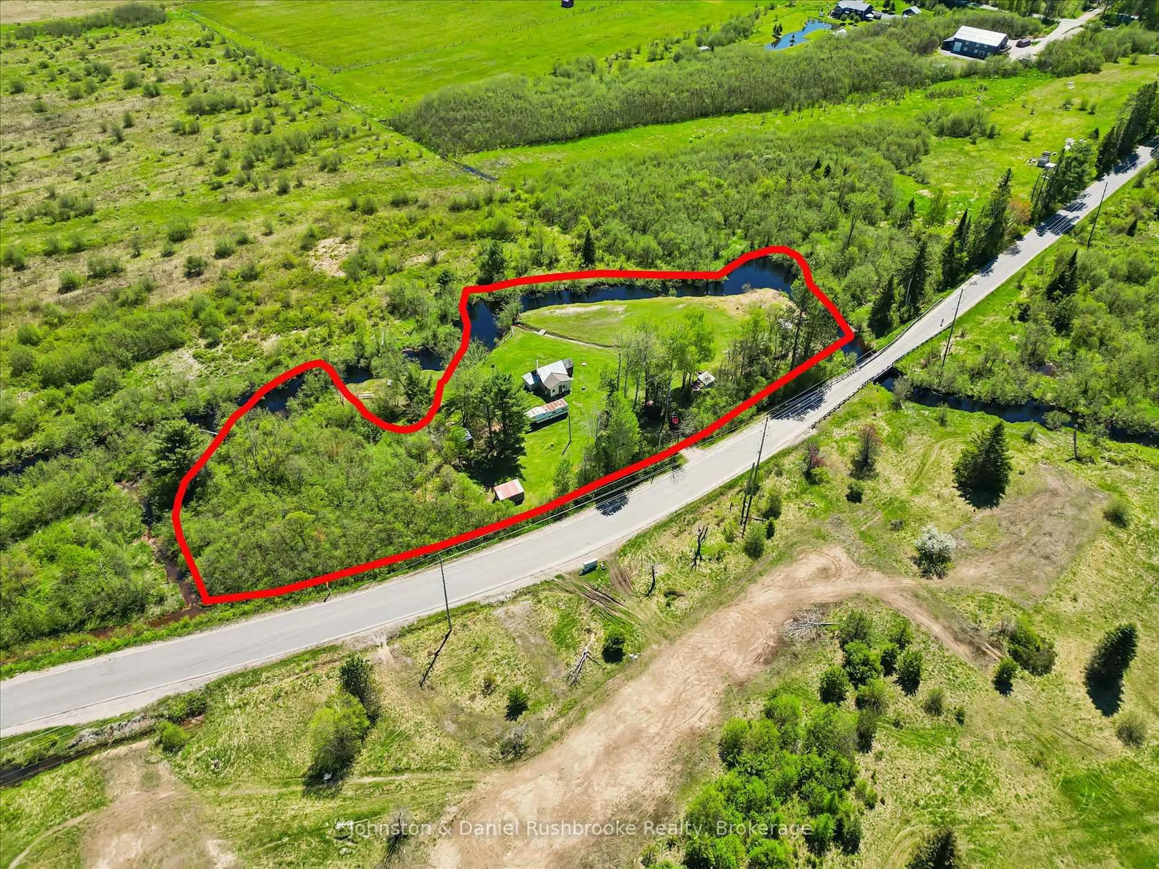 A pic from outside/outdoor area/front of a property/back of a property/a pic from drone, street for 68 Rowanwood Rd, Huntsville Ontario P0B 1M0