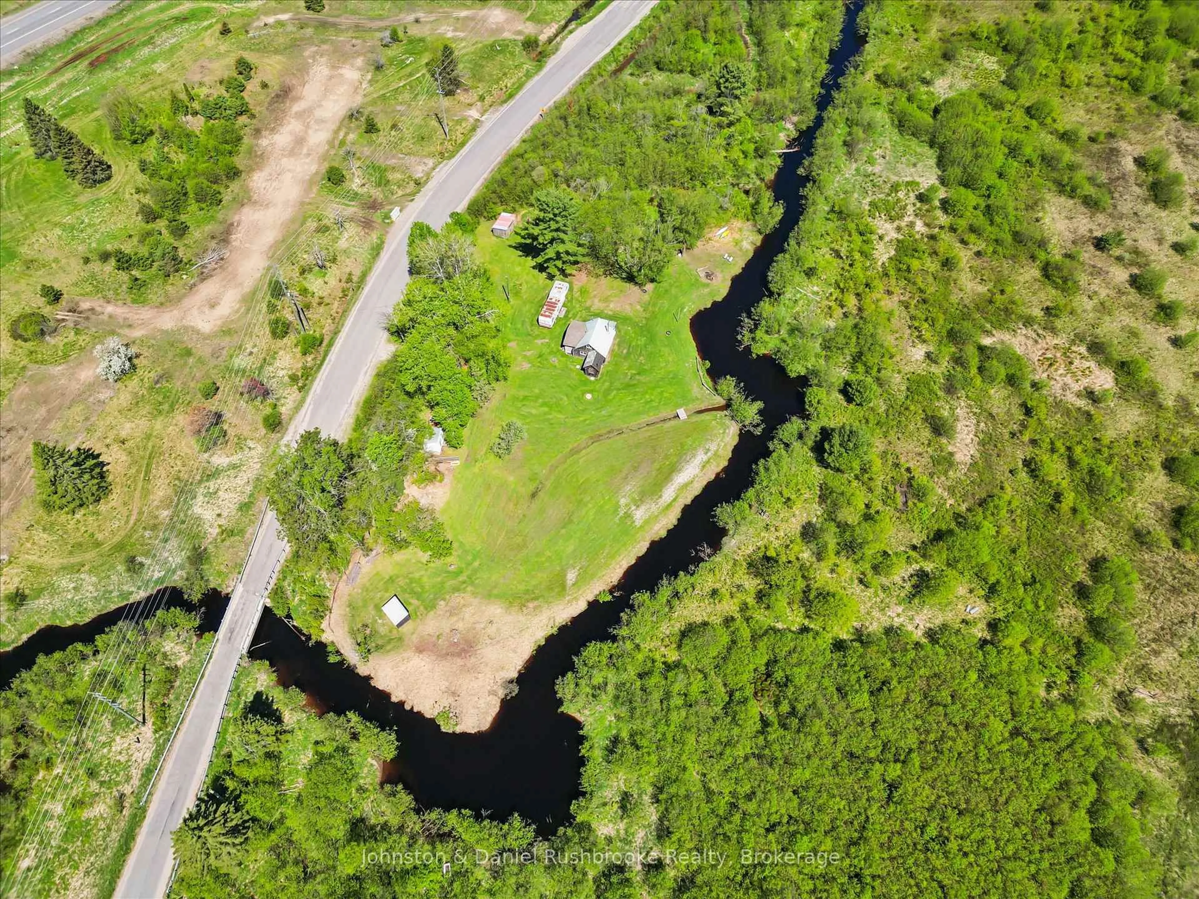A pic from outside/outdoor area/front of a property/back of a property/a pic from drone, water/lake/river/ocean view for 68 Rowanwood Rd, Huntsville Ontario P0B 1M0