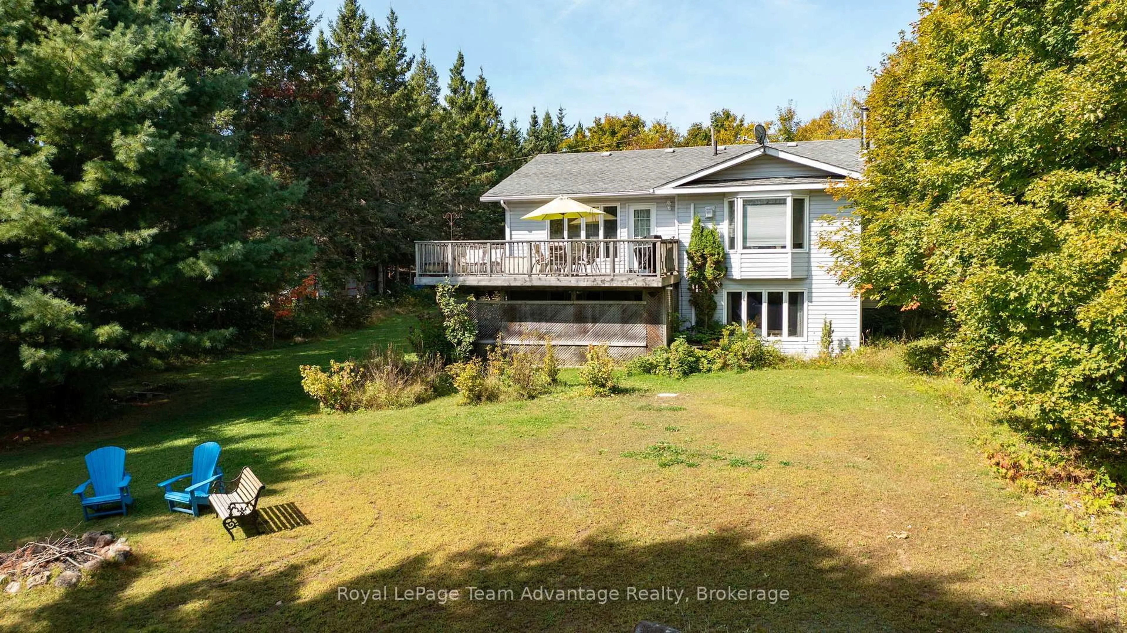 A pic from outside/outdoor area/front of a property/back of a property/a pic from drone, water/lake/river/ocean view for 22 Silver Birch Circ, McKellar Ontario P2A 0B5