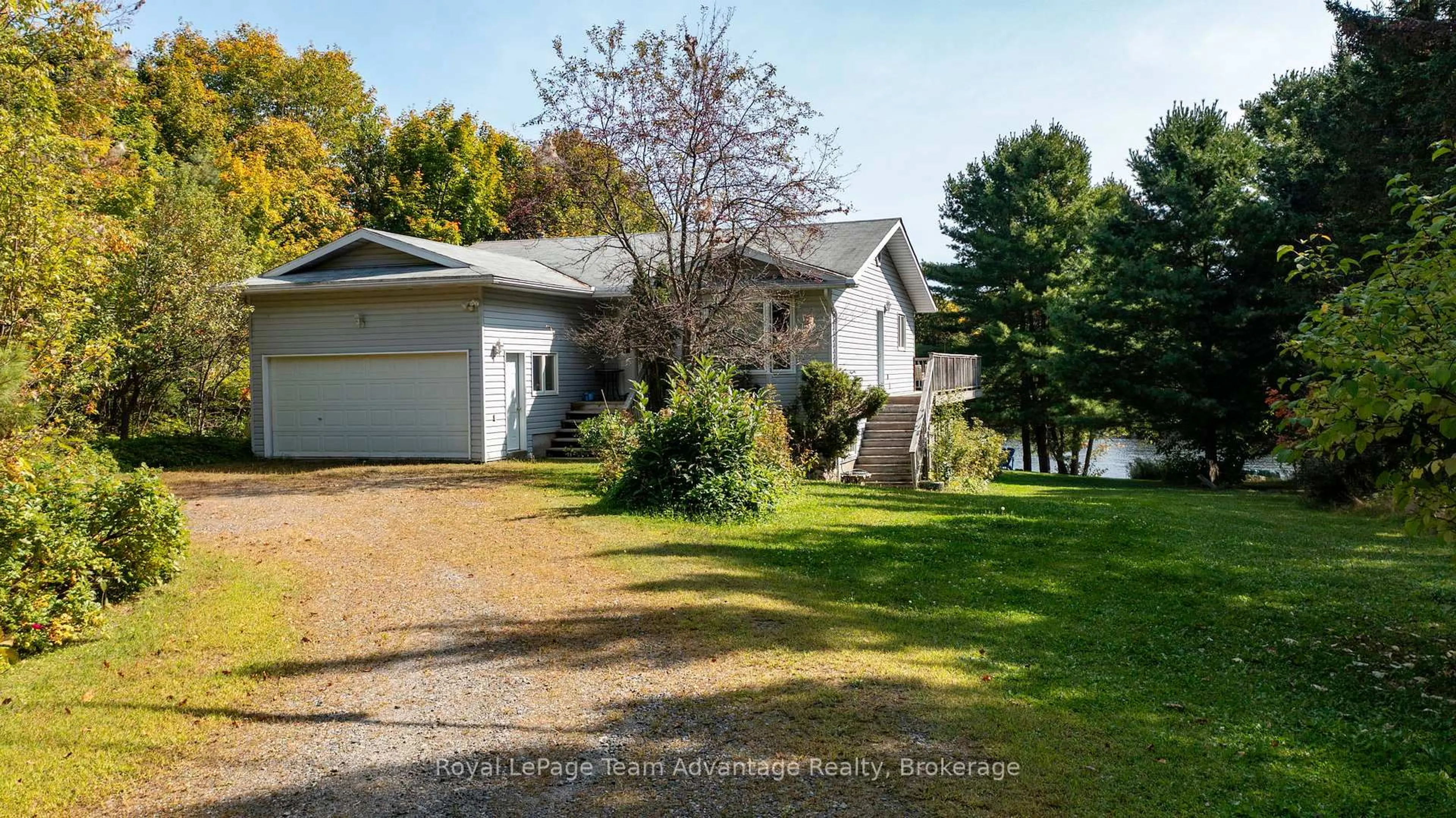 A pic from outside/outdoor area/front of a property/back of a property/a pic from drone, water/lake/river/ocean view for 22 Silver Birch Circ, McKellar Ontario P2A 0B5