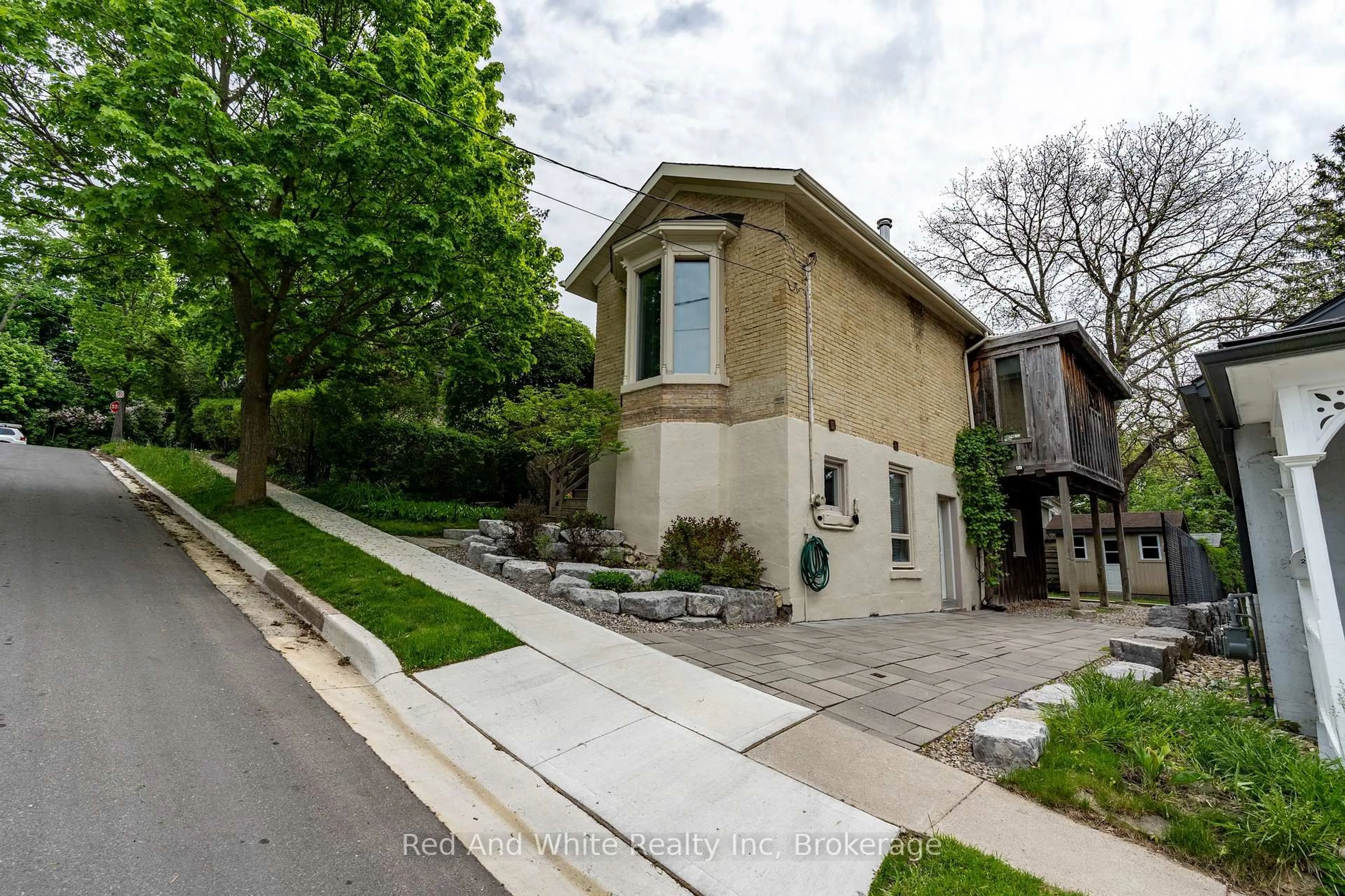 Home with brick exterior material, street for 23 Pearl St, Guelph Ontario N1E 2E4