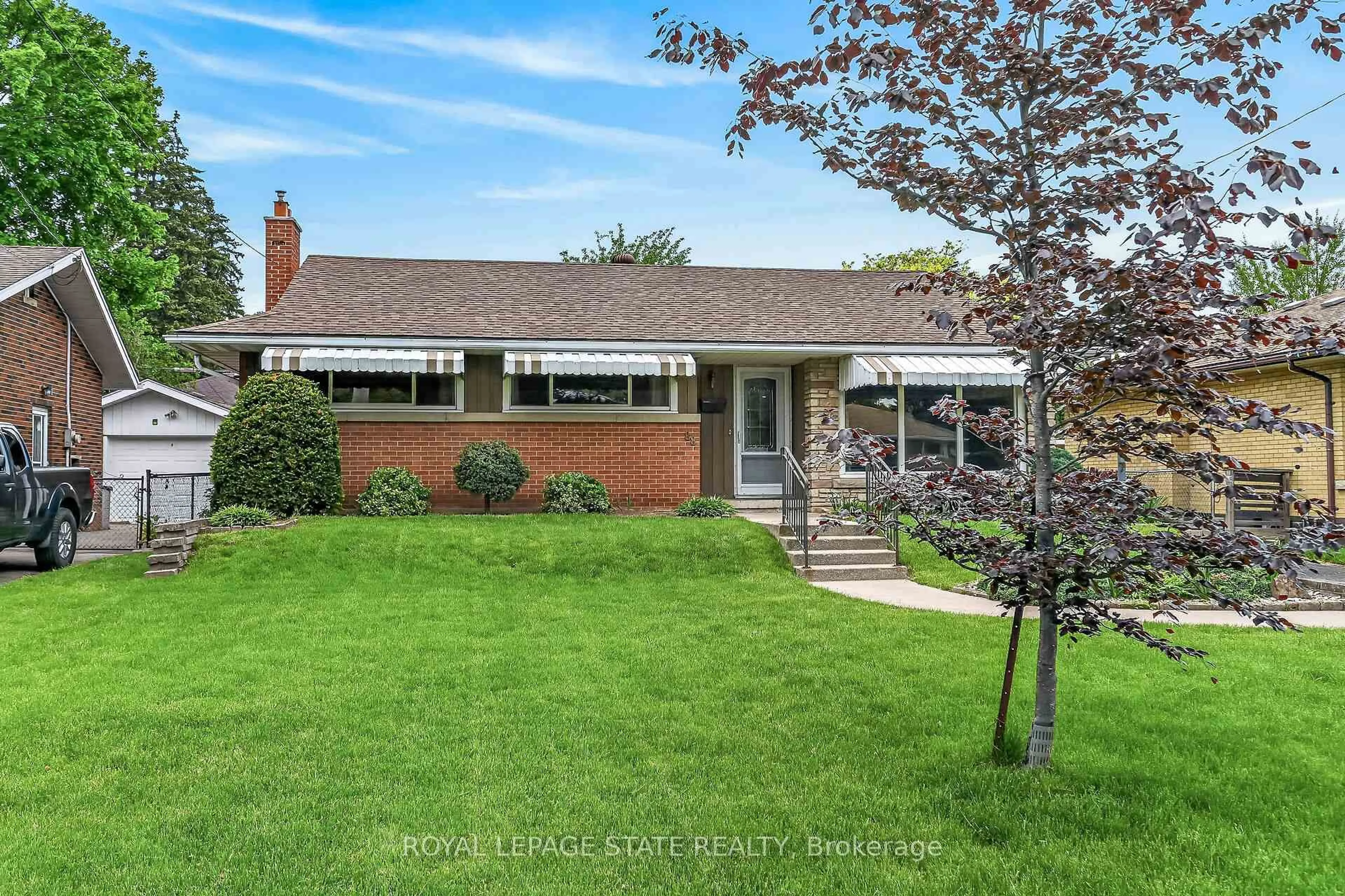 Home with brick exterior material, street for 88 West 33rd St, Hamilton Ontario L9C 5J1