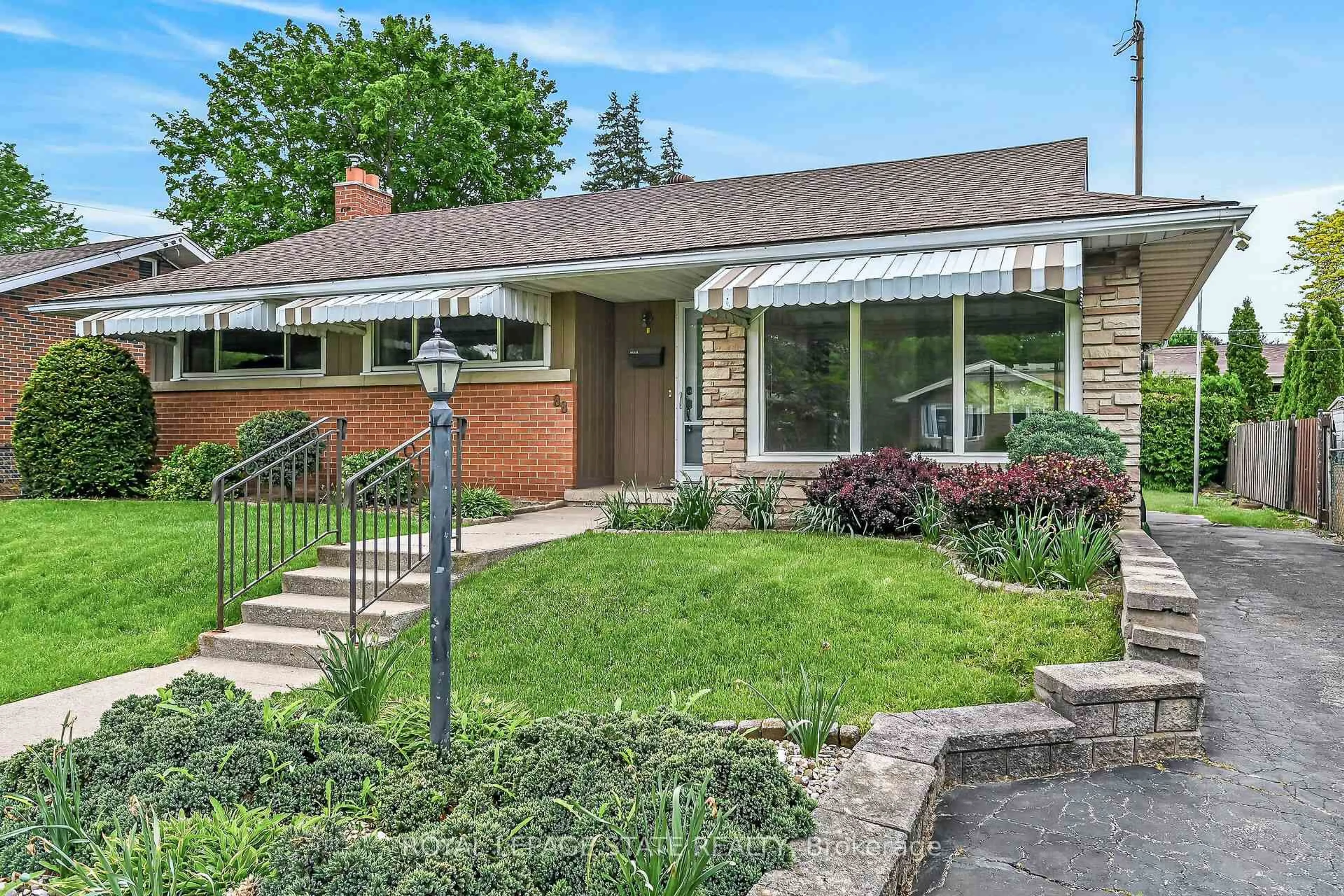 Home with brick exterior material, street for 88 West 33rd St, Hamilton Ontario L9C 5J1