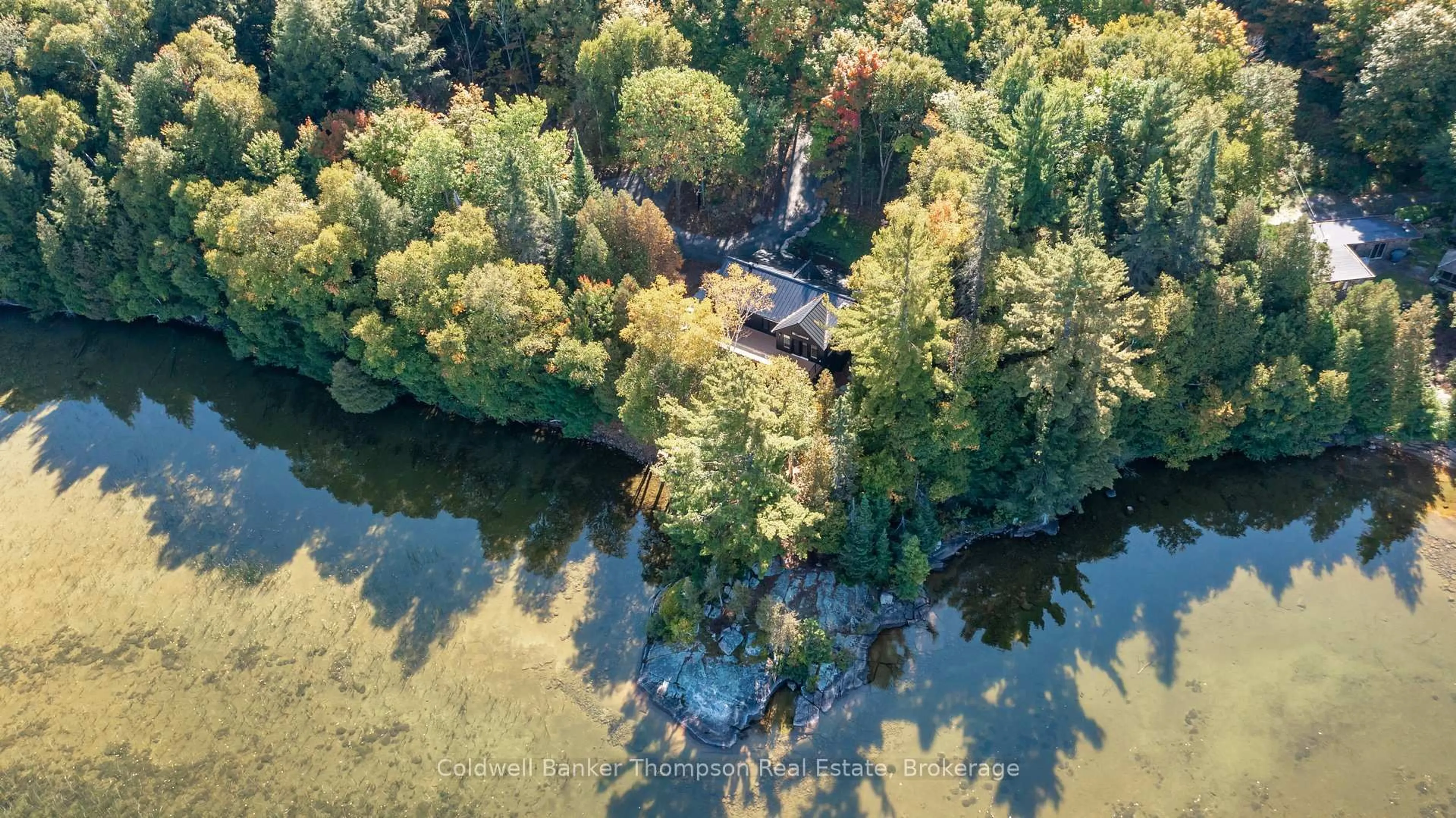 A pic from outside/outdoor area/front of a property/back of a property/a pic from drone, water/lake/river/ocean view for 1108 South Bernard Lake Rd, Sundridge Ontario P0A 1Z0