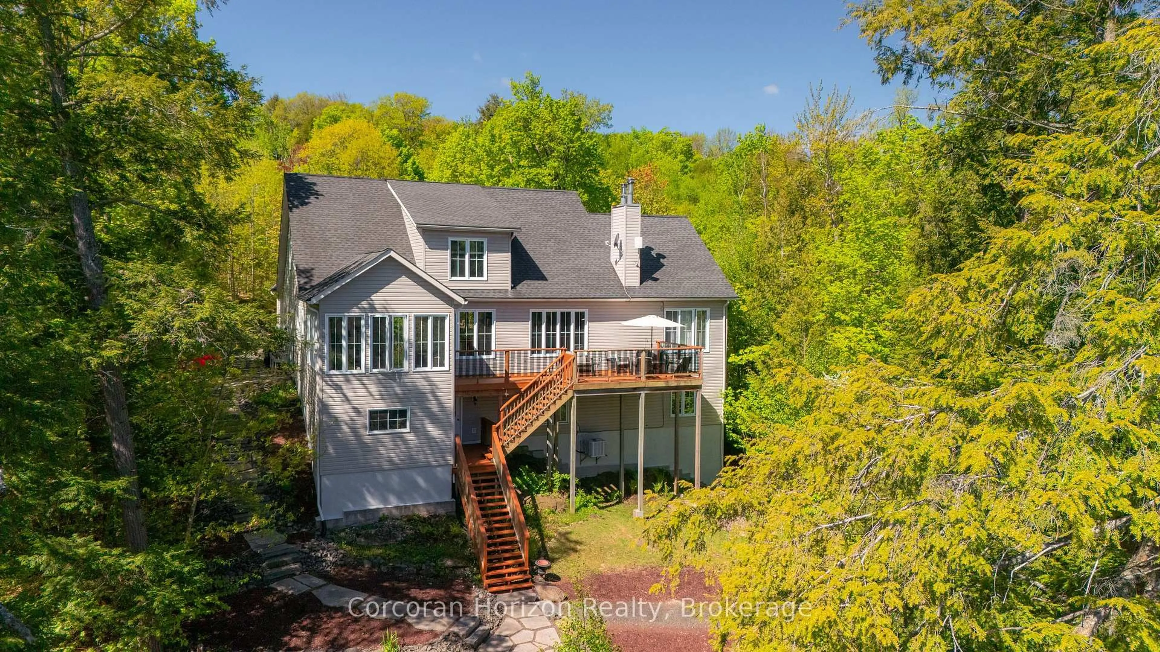 A pic from outside/outdoor area/front of a property/back of a property/a pic from drone, water/lake/river/ocean view for 15 LYNDSEY Lane, McKellar Ontario P2A 0B5