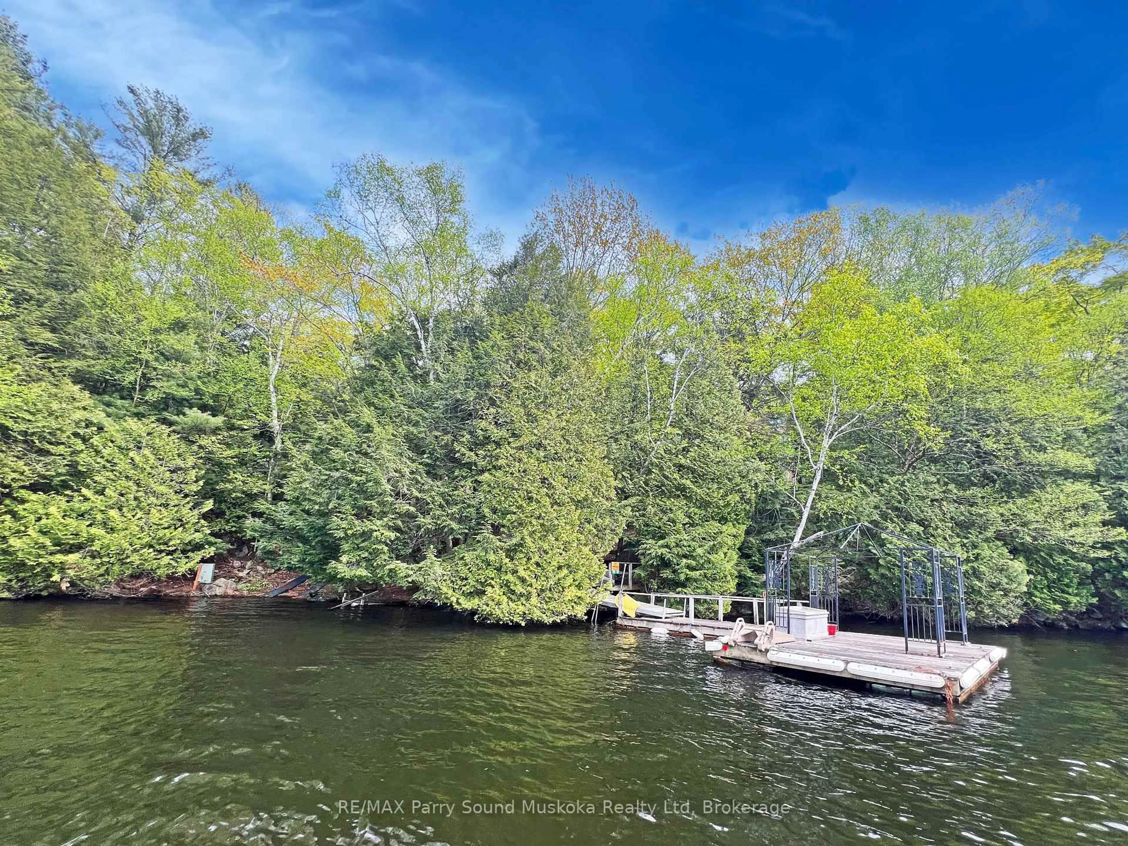 A pic from outside/outdoor area/front of a property/back of a property/a pic from drone, water/lake/river/ocean view for 825 Otter Lake WA 128, Seguin Ontario P2A 0B2