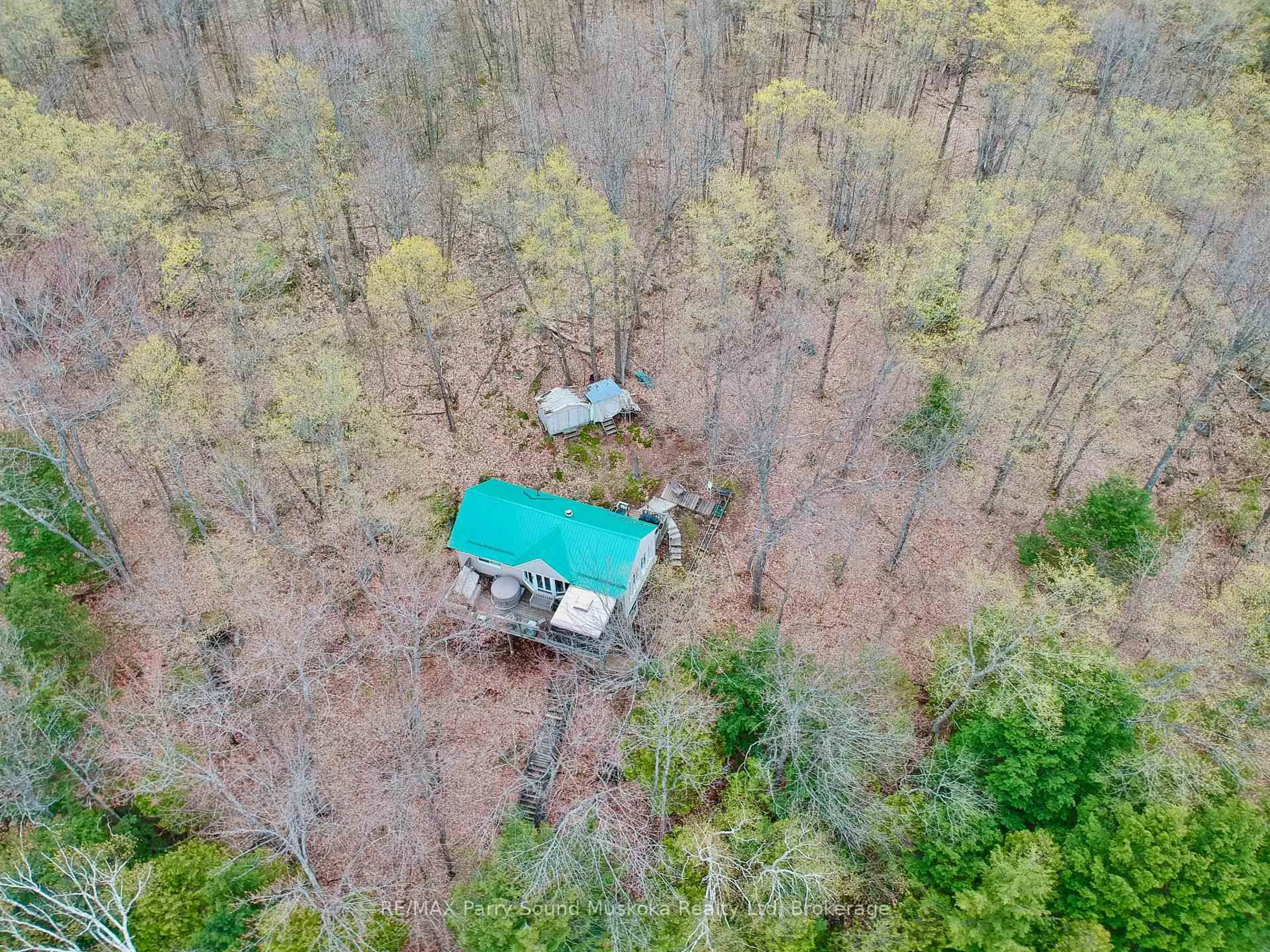 A pic from outside/outdoor area/front of a property/back of a property/a pic from drone, forest/trees view for 825 Otter Lake WA 128, Seguin Ontario P2A 0B2