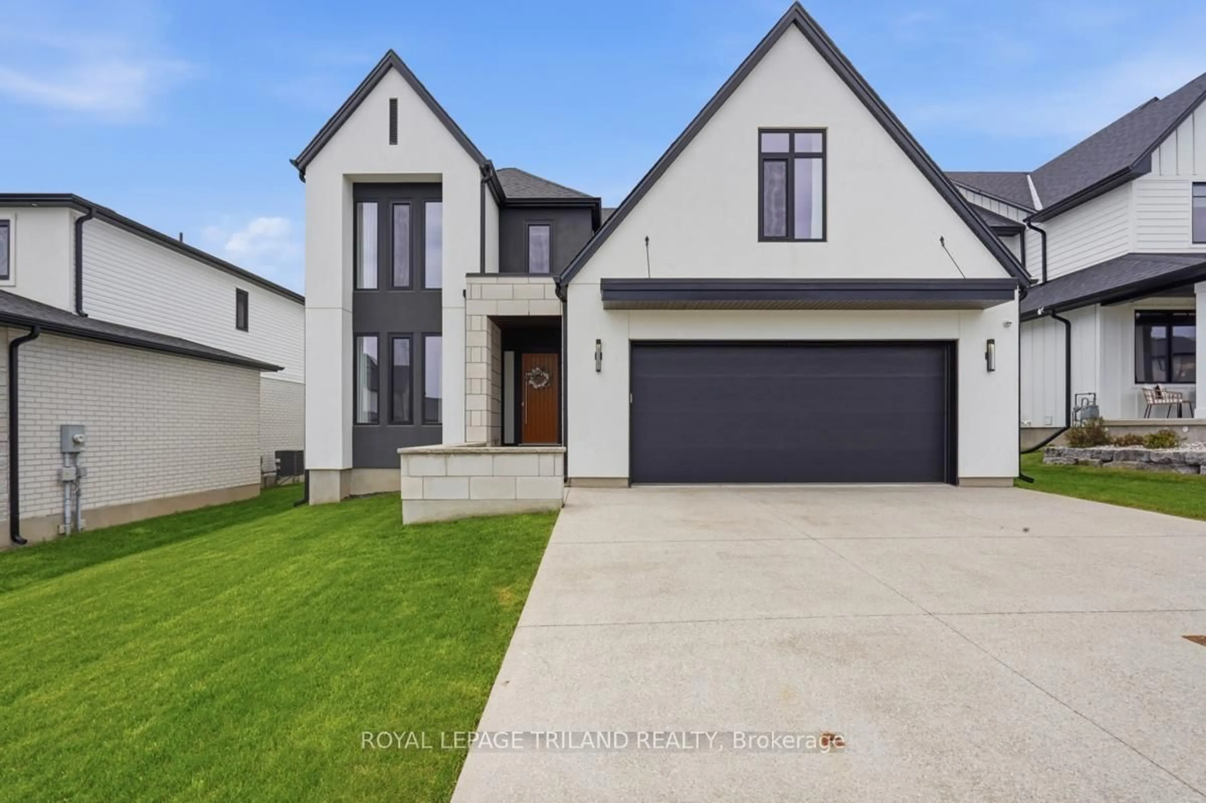 Home with brick exterior material, street for 77 Crestview Dr, Middlesex Centre Ontario N0L 1R0